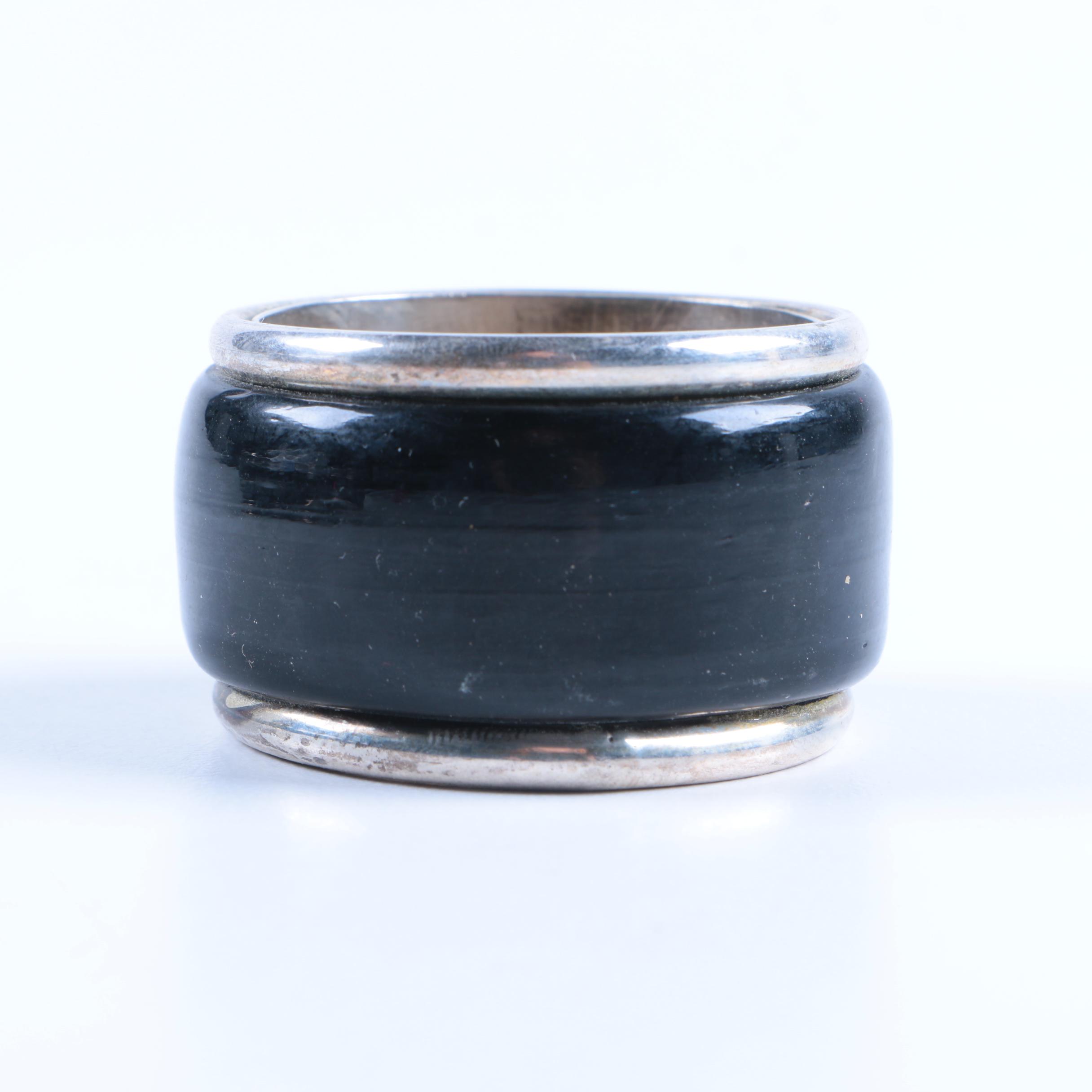 Set of Silver Tone and Black Lacquered Napkin Rings