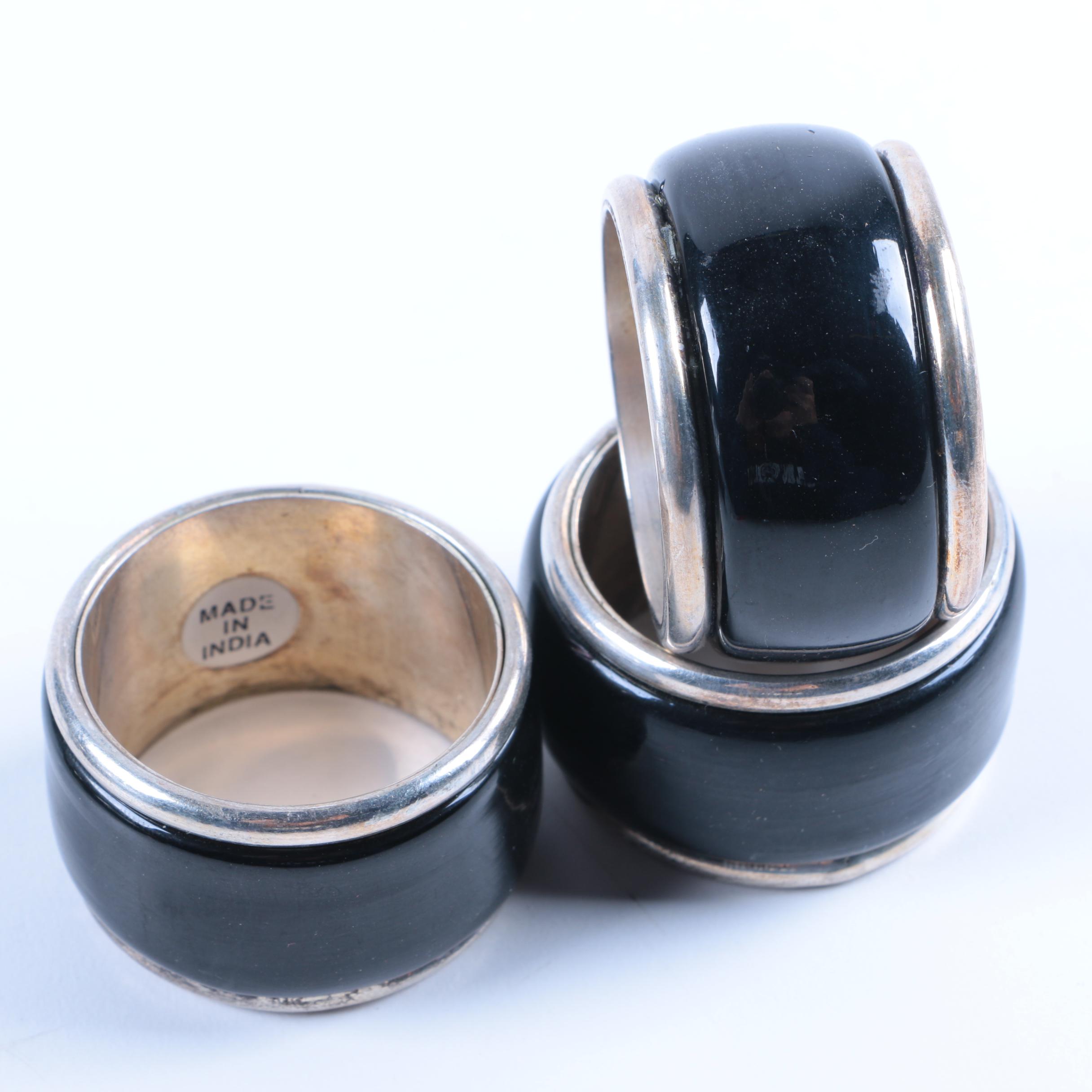 Set of Silver Tone and Black Lacquered Napkin Rings