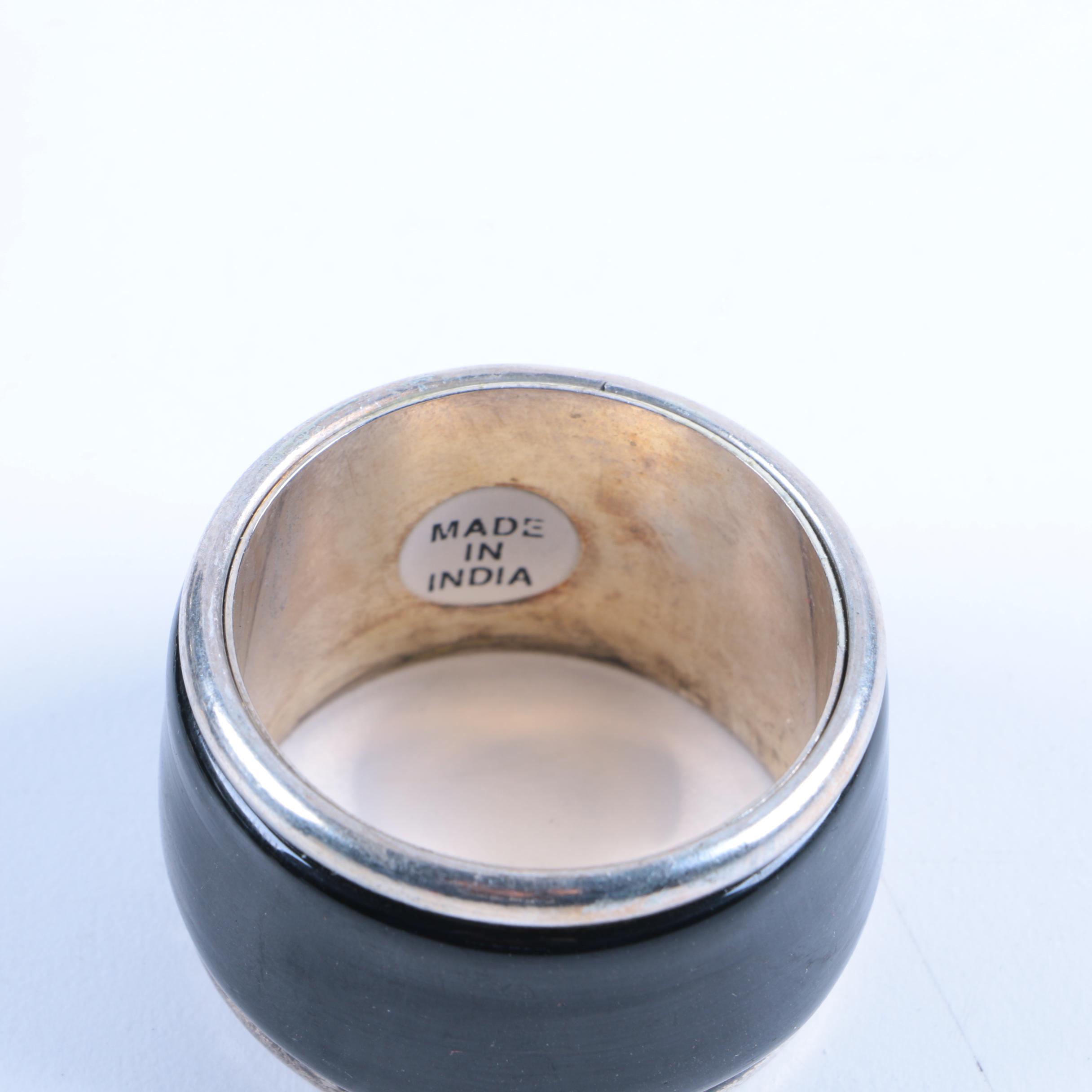 Set of Silver Tone and Black Lacquered Napkin Rings