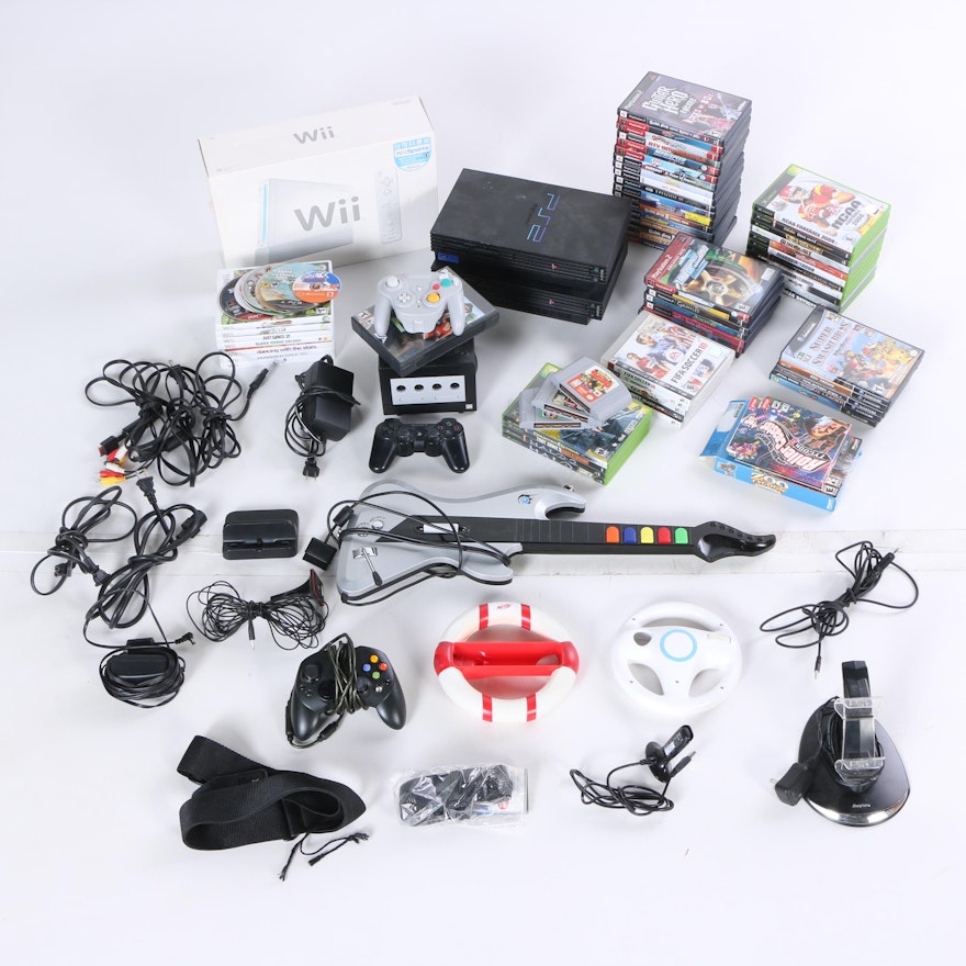 Assortment of Video Game Consoles, Games, and Controllers