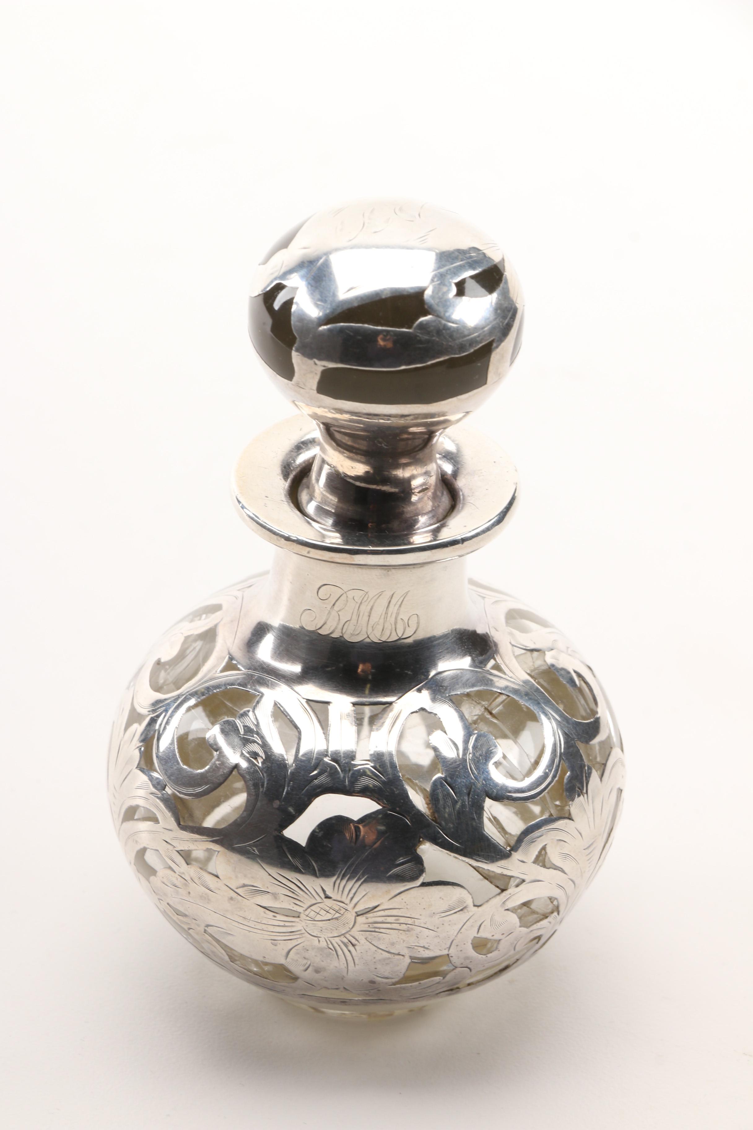 Christian Dior Perfume Bottle and Other Bottles Featuring Sterling