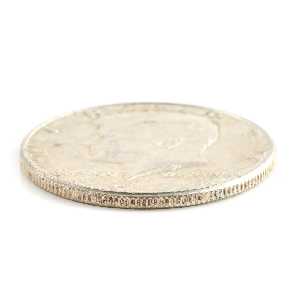 Four Franklin Silver Half Dollars and a Kennedy Silver Half Dollar