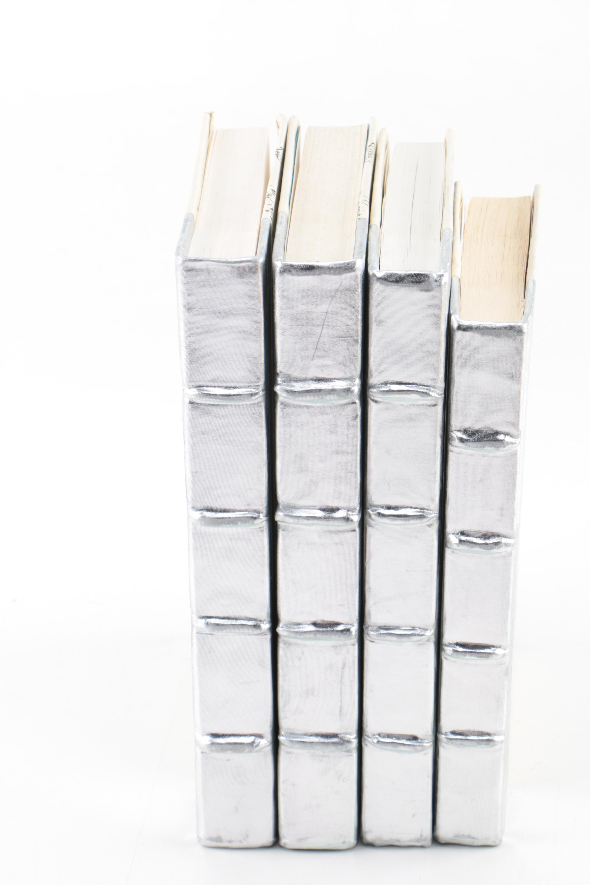 Collection of Hardcover Books featuing Custom Metallic Binding