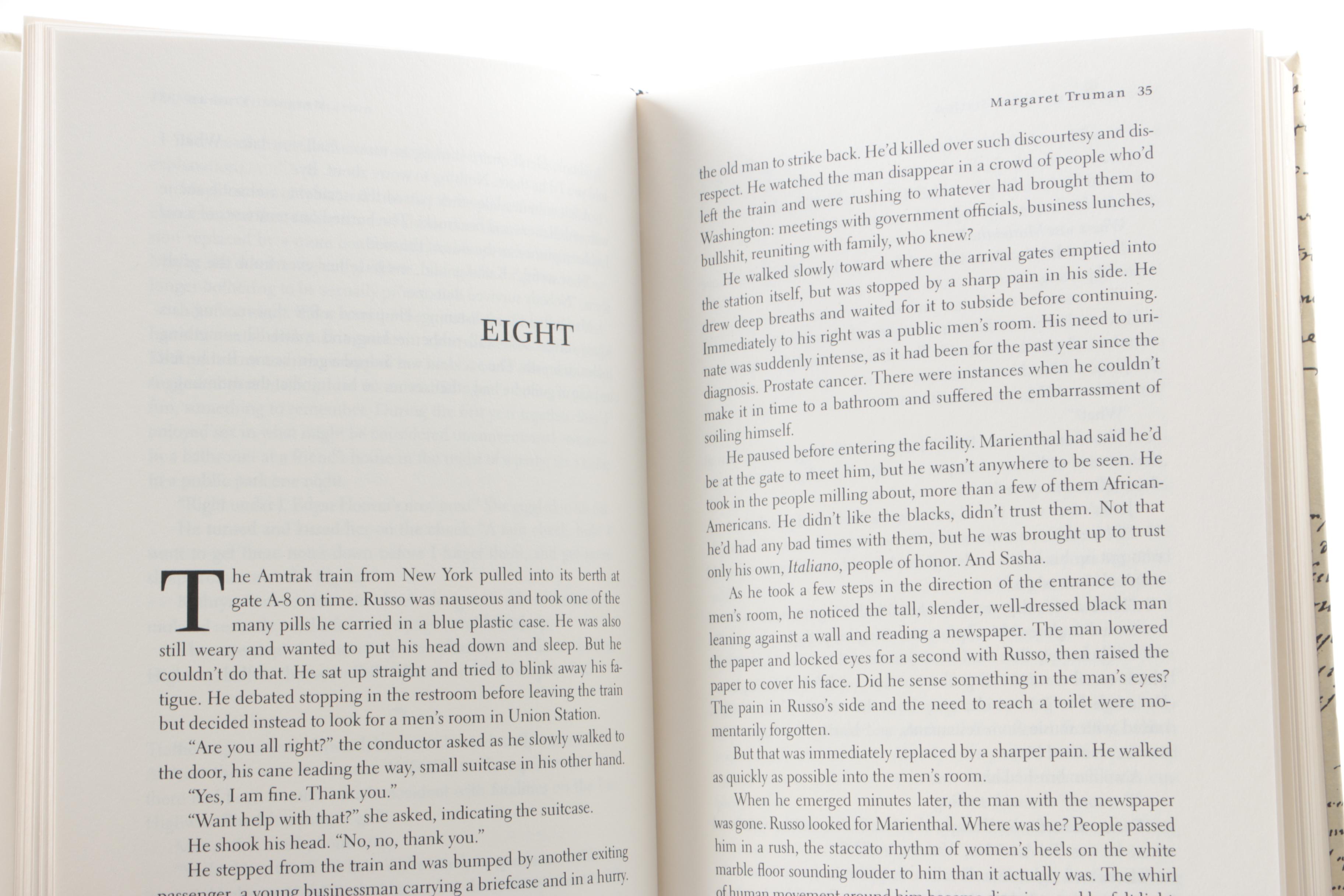 Collection of Hardcover Books featuing Custom Metallic Binding