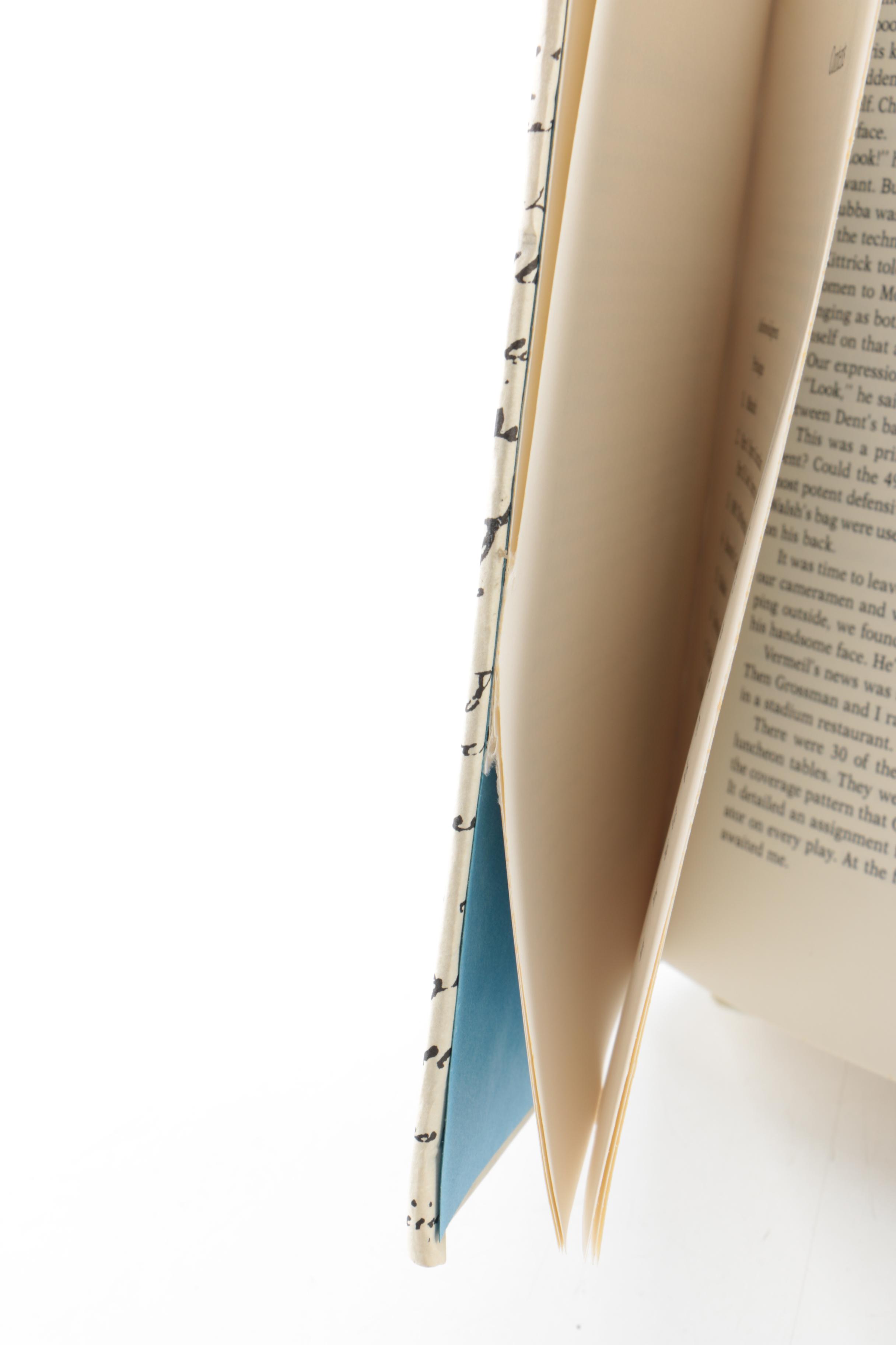 Collection of Hardcover Books featuing Custom Metallic Binding