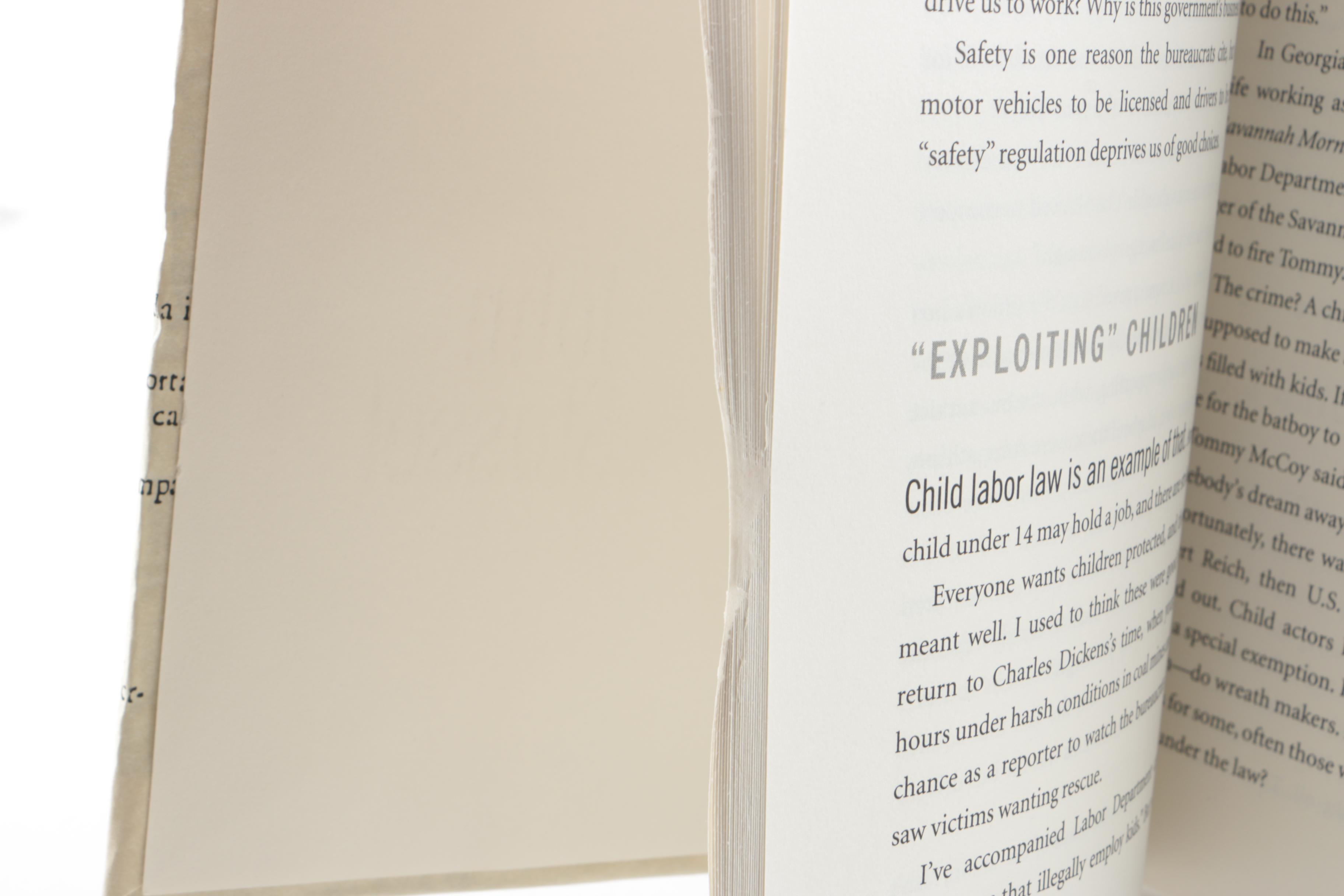 Collection of Hardcover Books featuing Custom Metallic Binding