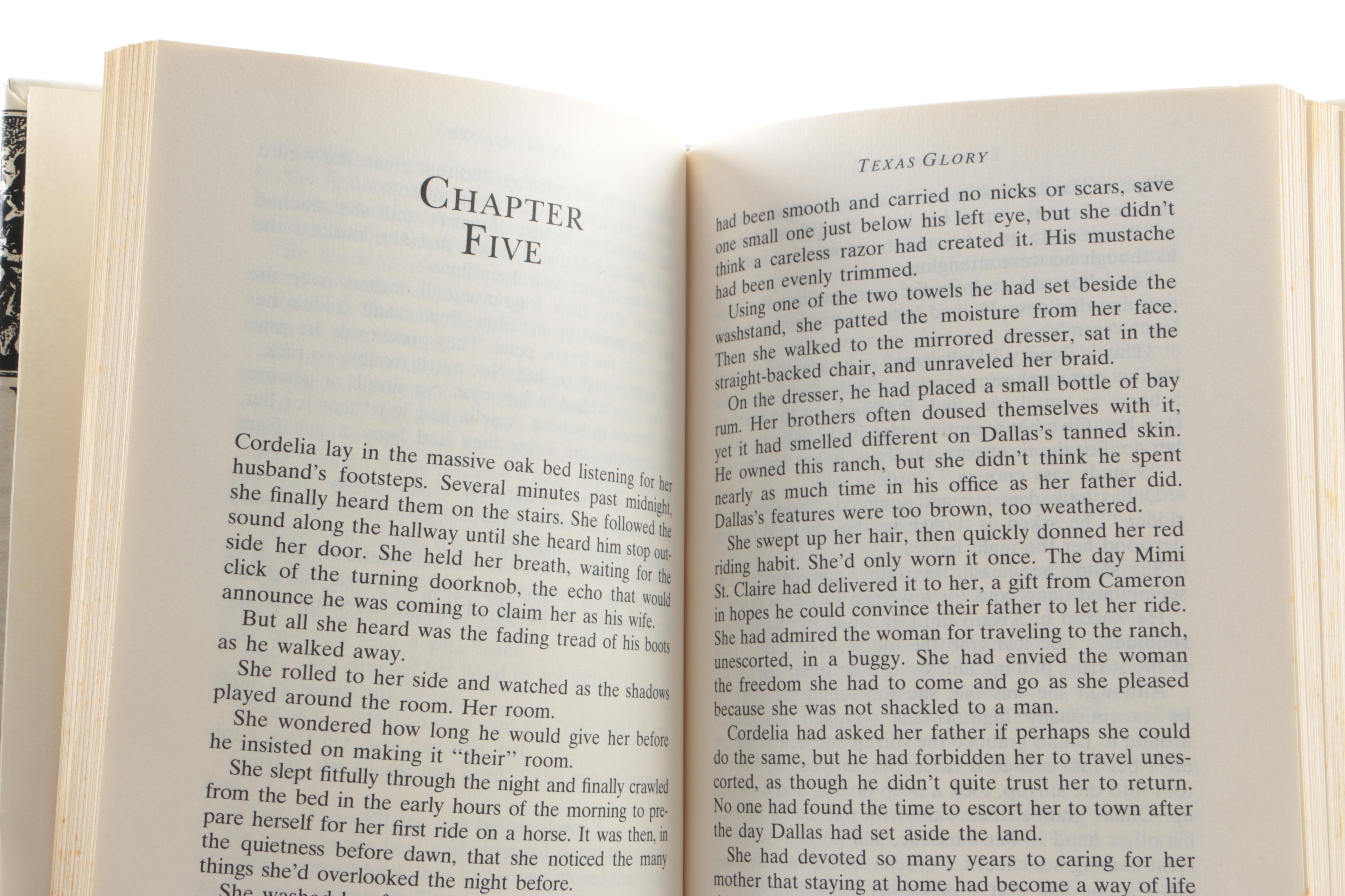 Collection of Hardcover Books featuing Custom Metallic Binding