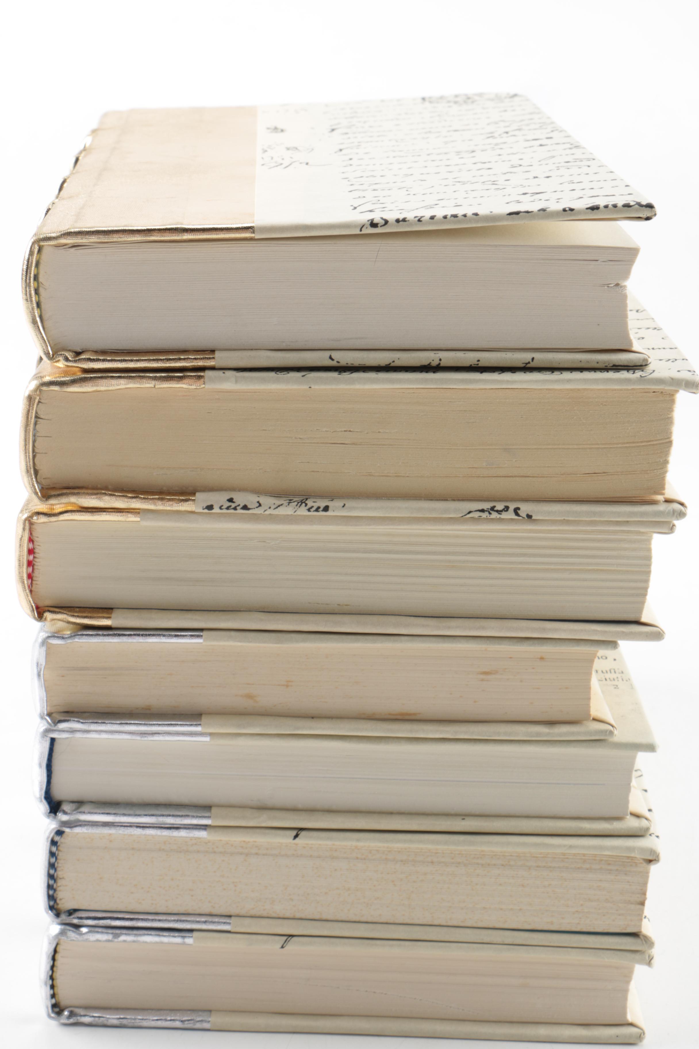 Collection of Hardcover Books featuing Custom Metallic Binding