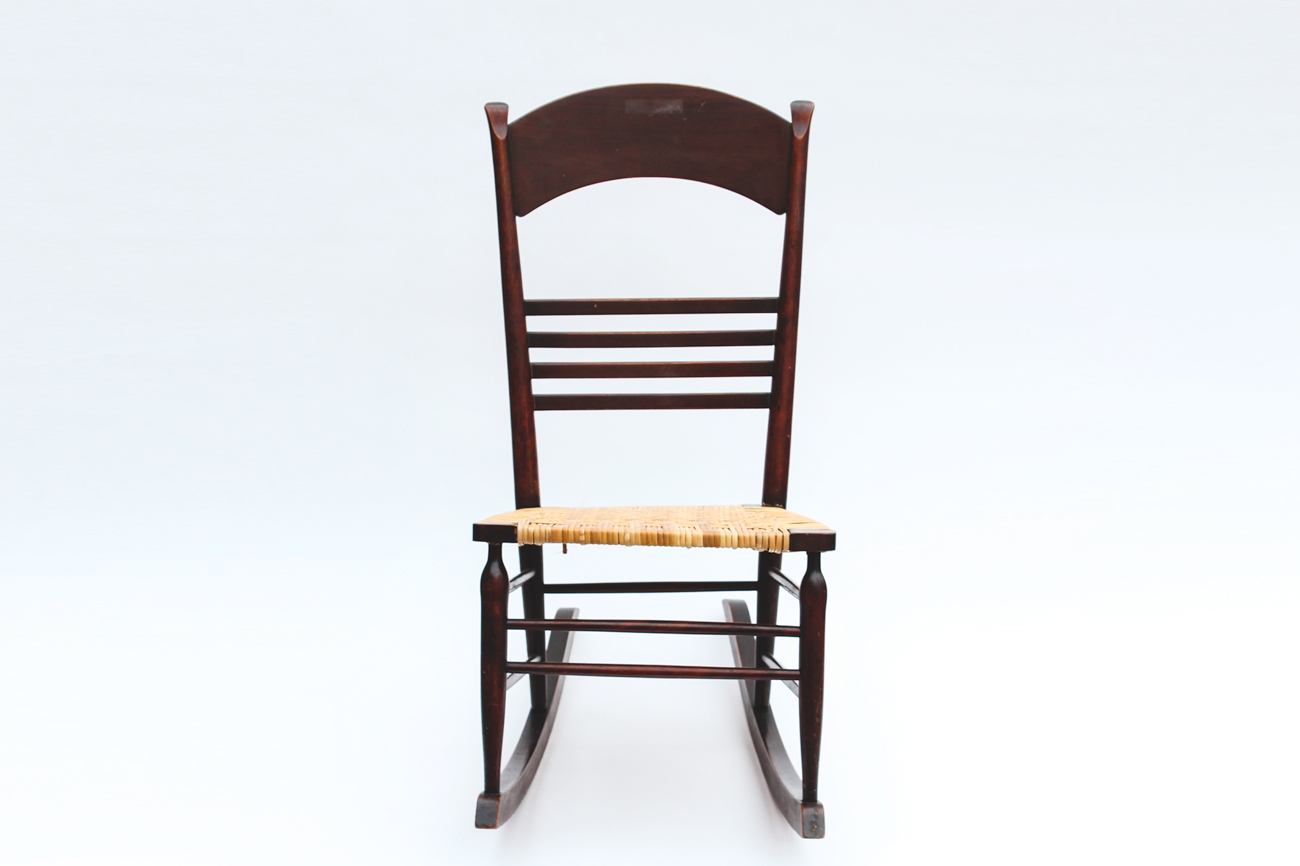 Dark Wood and Wicker Rocking Chair