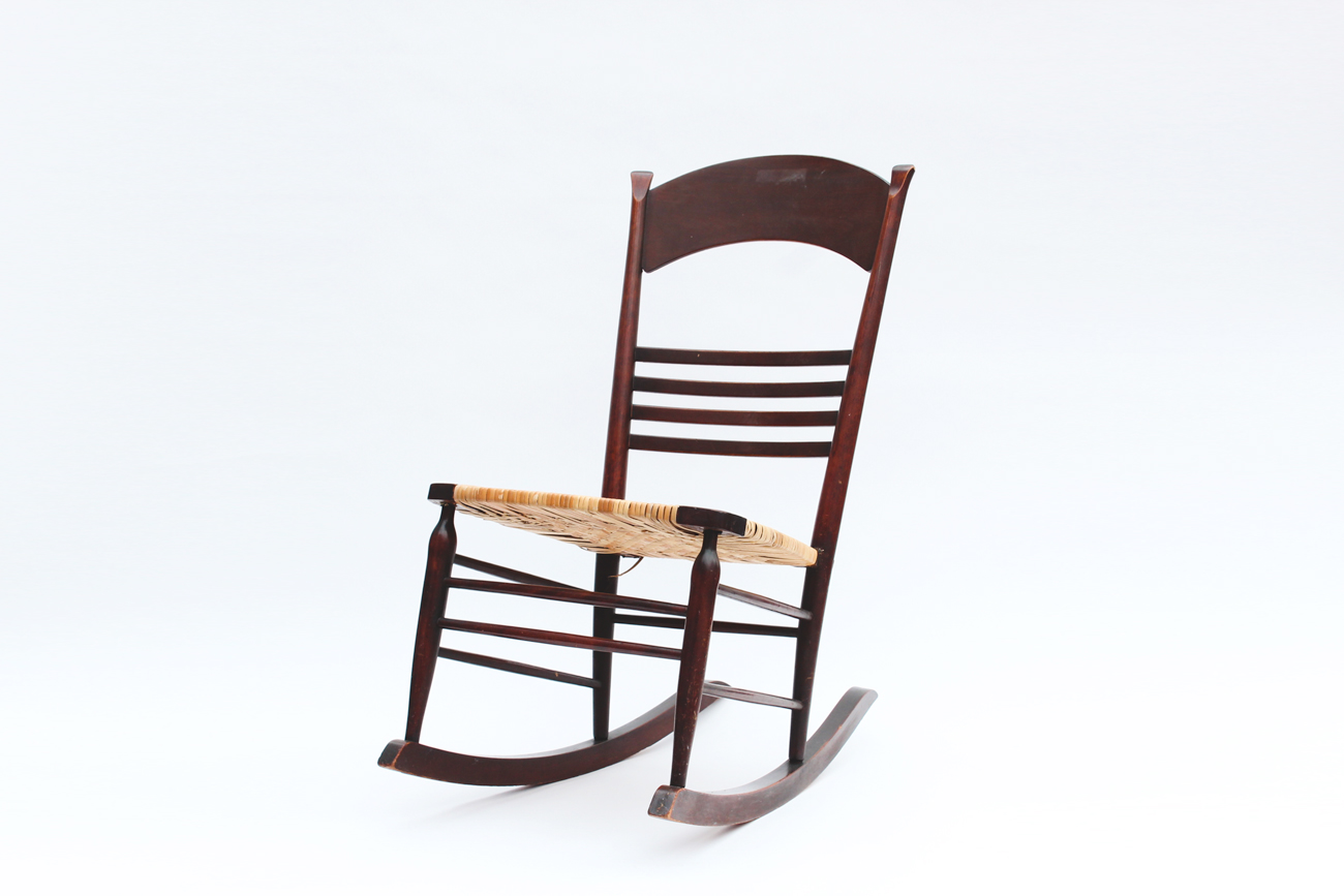 Dark Wood and Wicker Rocking Chair