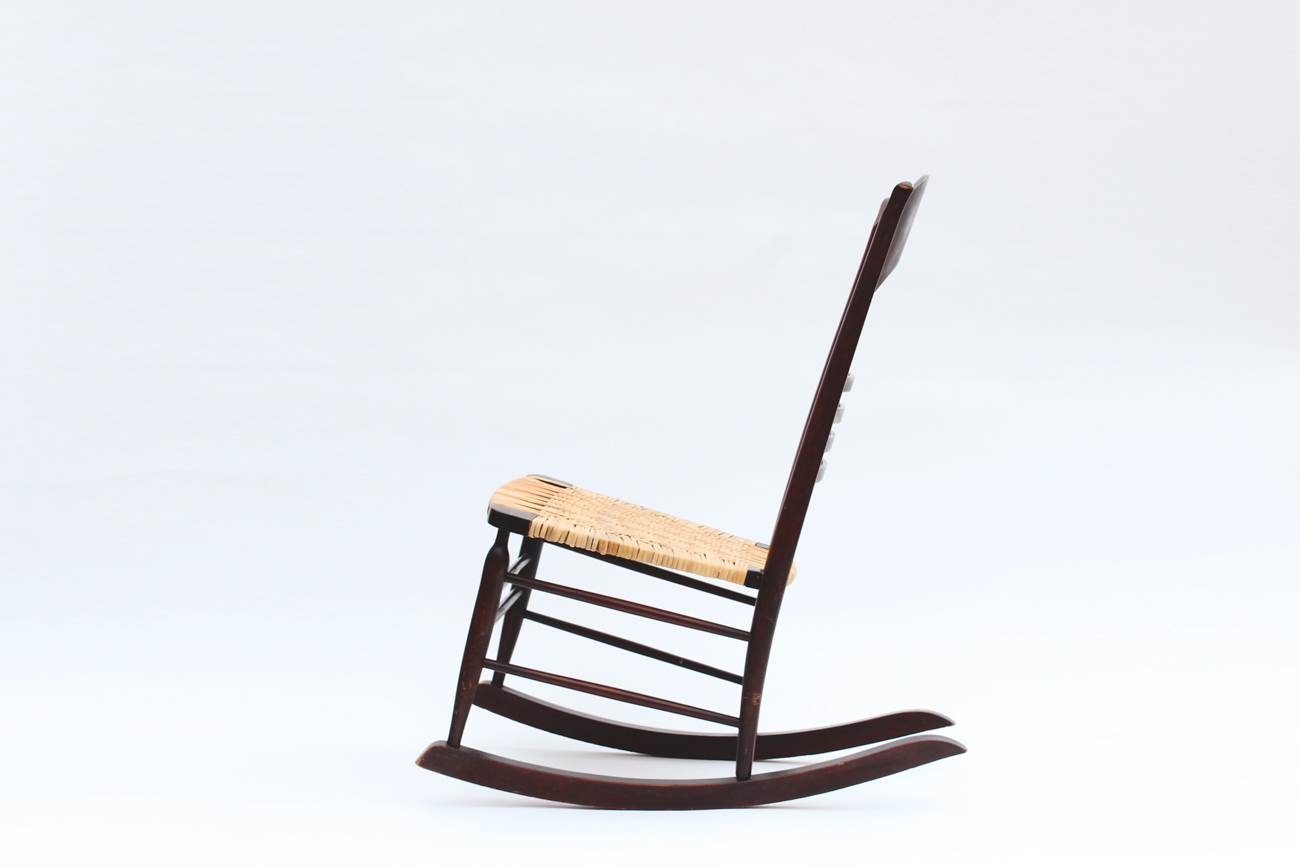 Dark Wood and Wicker Rocking Chair