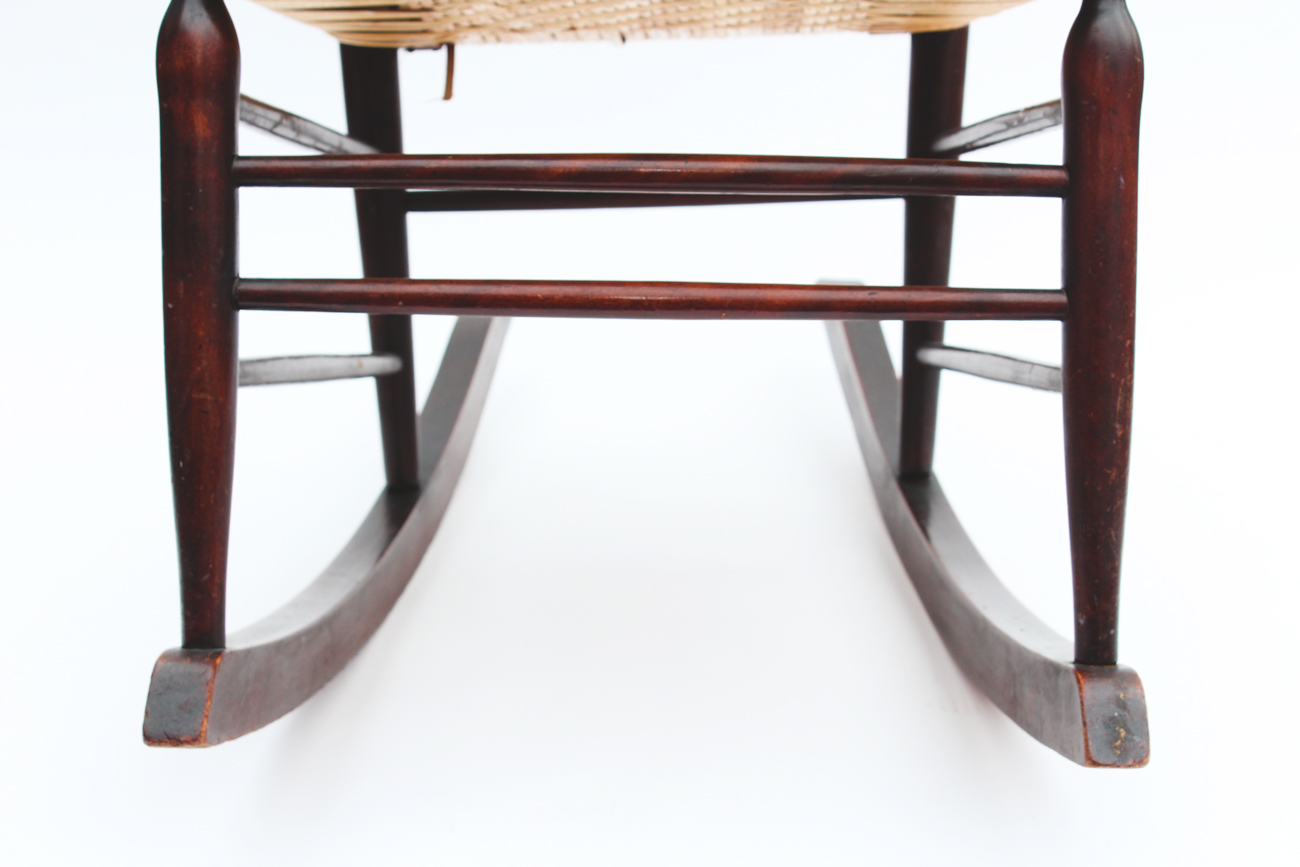 Dark Wood and Wicker Rocking Chair