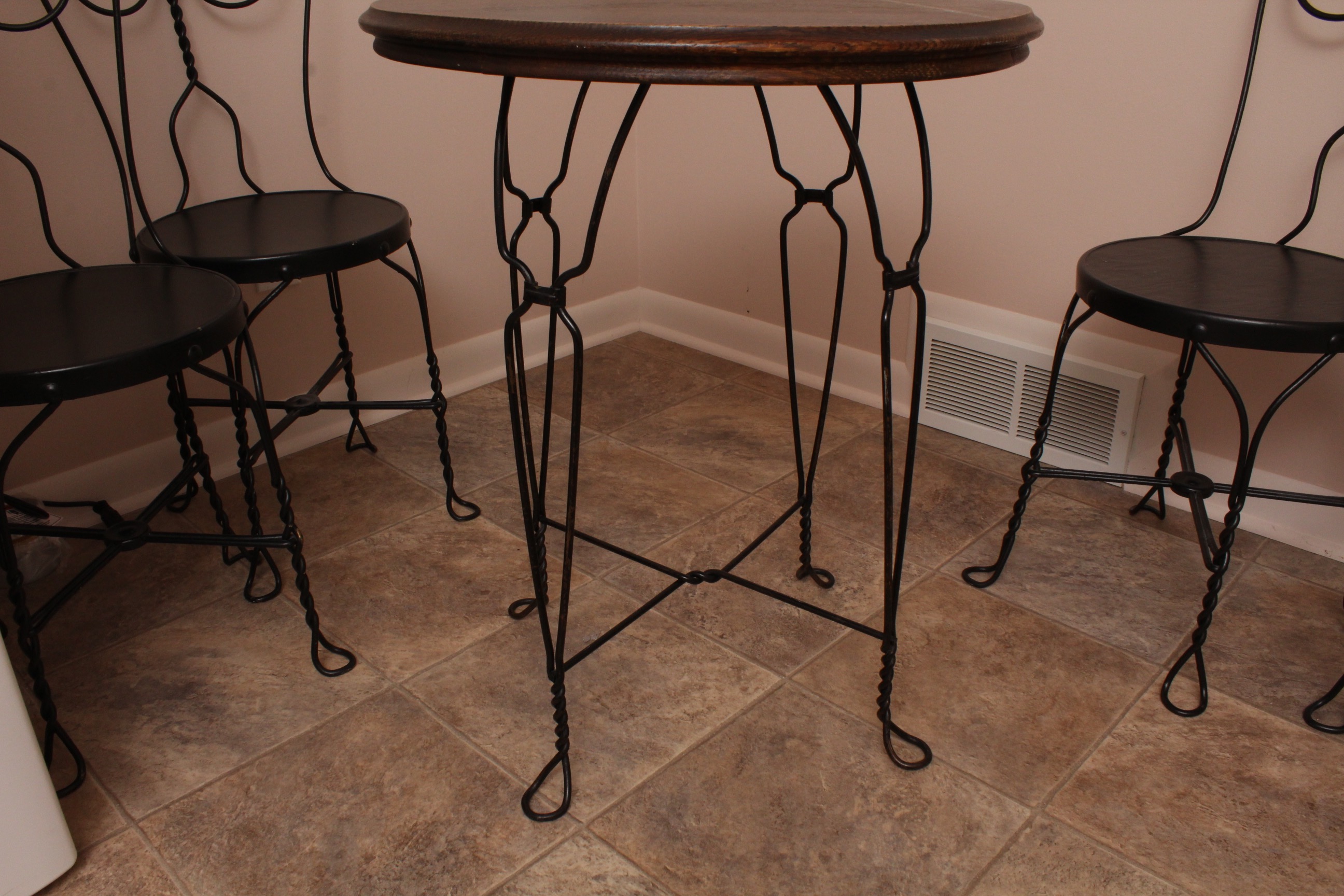 Vintage Wrought Iron Bistro Table with Four Chairs