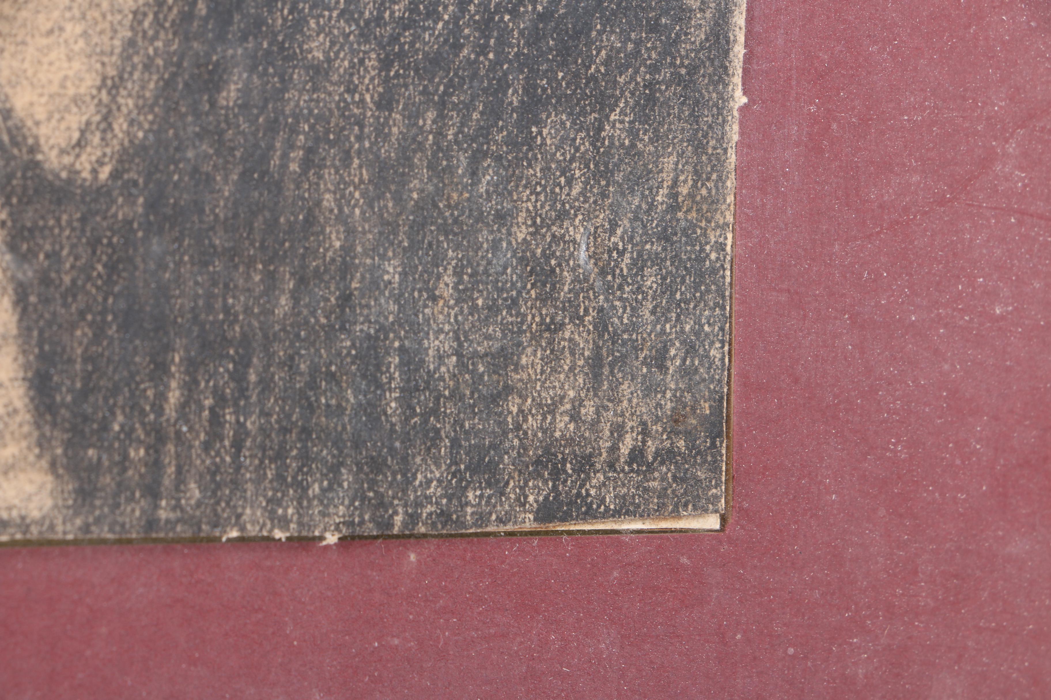 Charcoal Drawing of a Pensive Figure