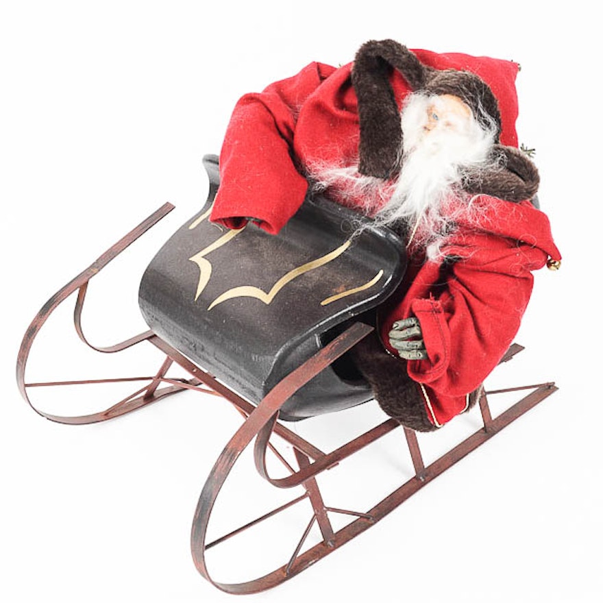 Large Santa Figurine on a Metal Sled