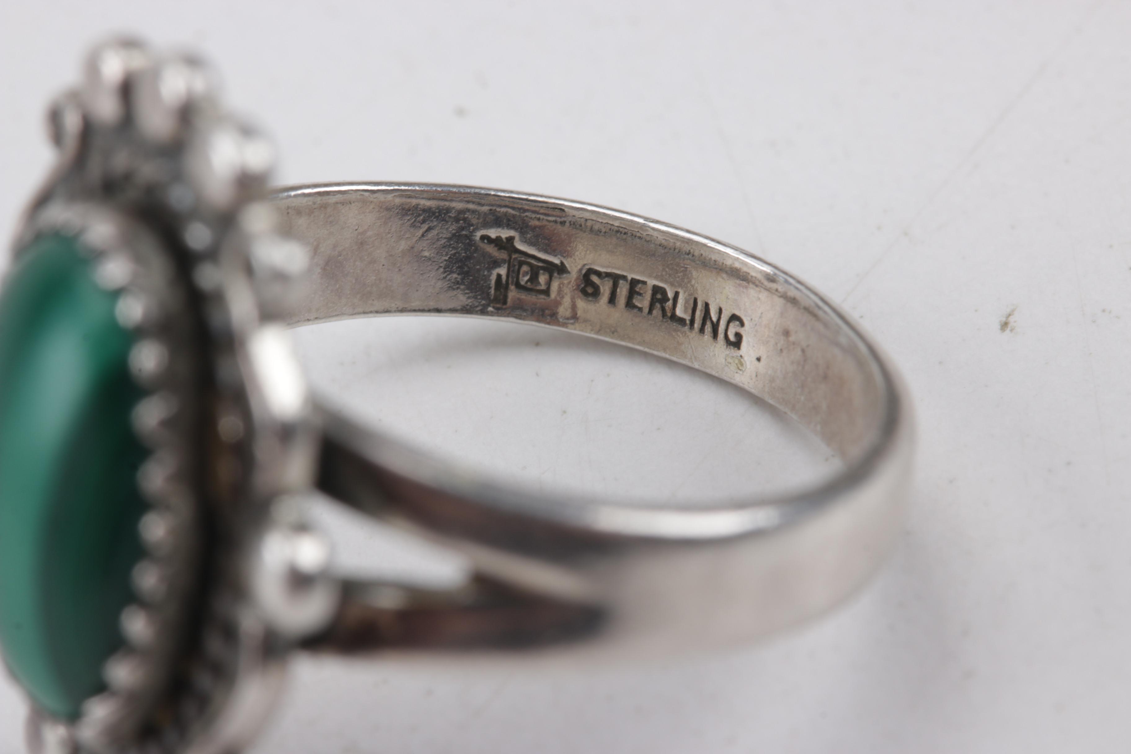 800 Silver Cuff Bracelet and Three Sterling Silver Rings Set with Mixed Stones