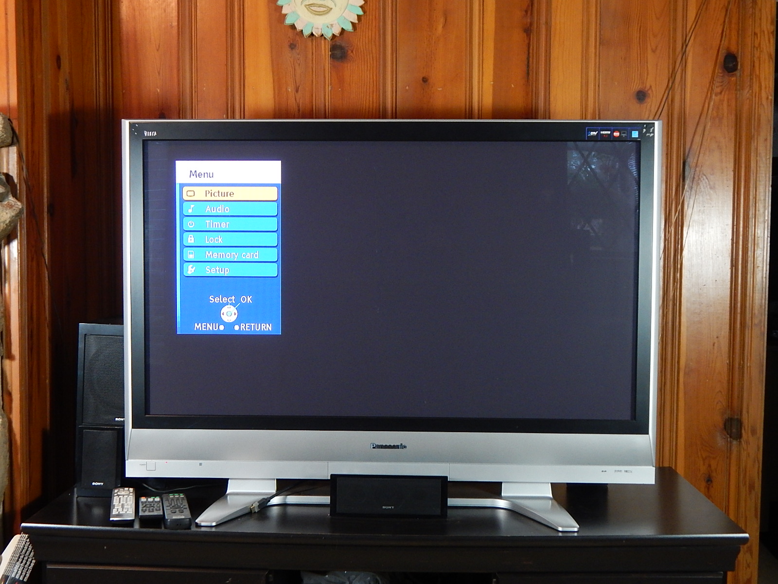 50" Panasonic Television and Stereo Equipment with Black Entertainment Console