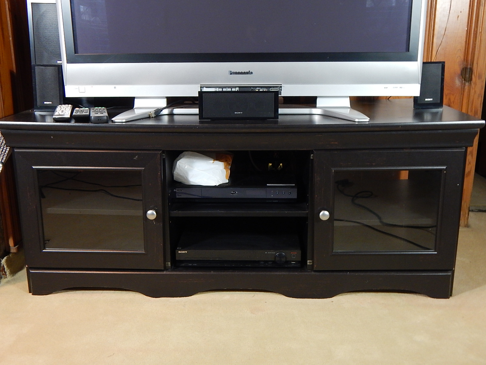 50" Panasonic Television and Stereo Equipment with Black Entertainment Console