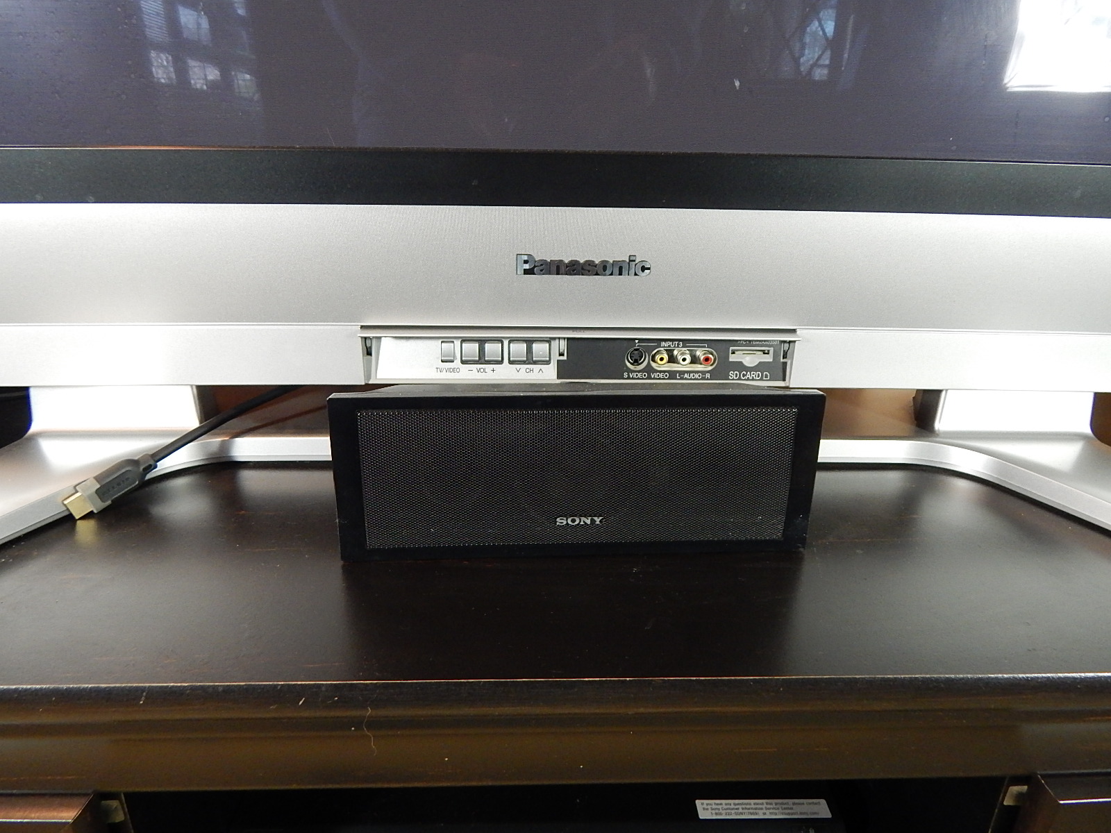 50" Panasonic Television and Stereo Equipment with Black Entertainment Console