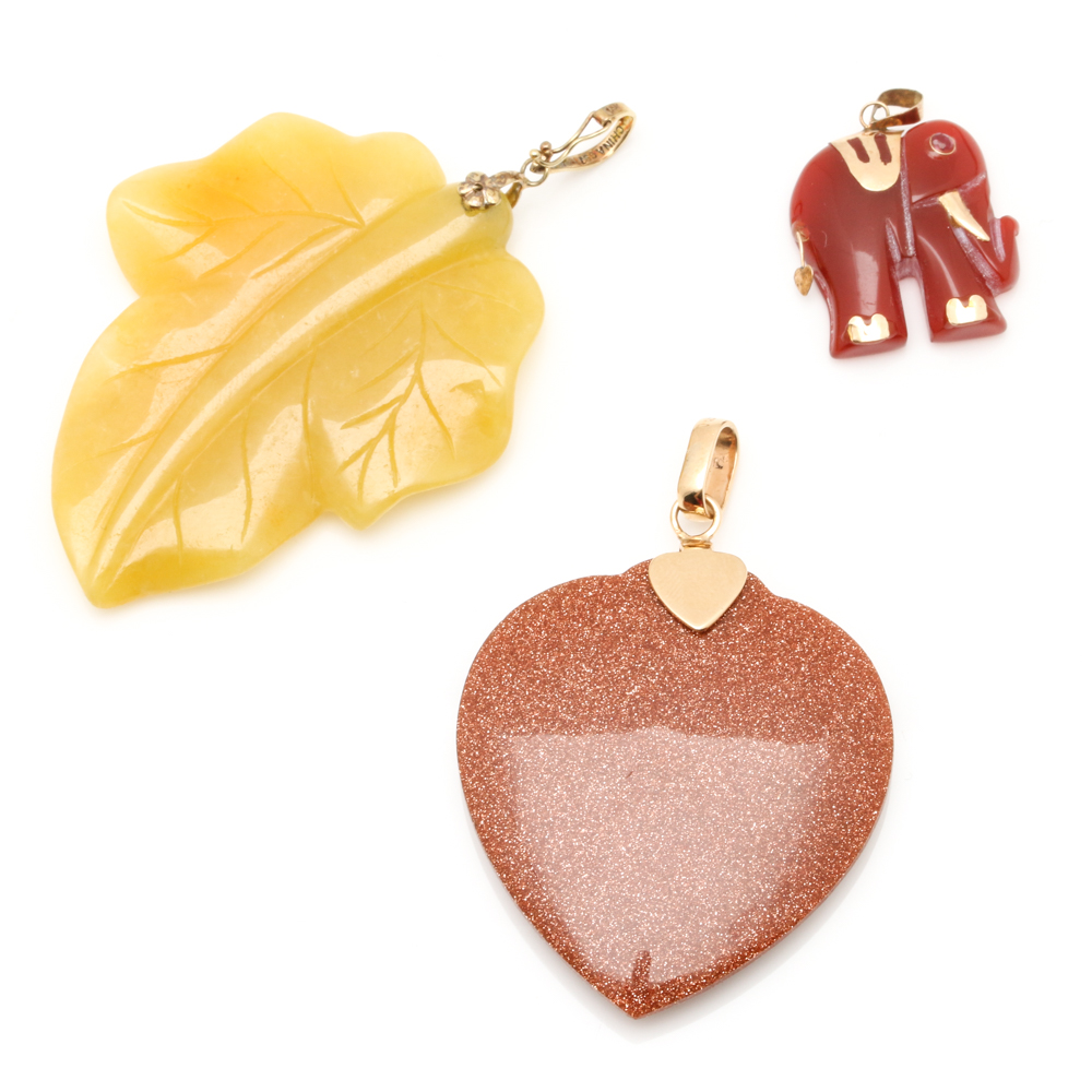 Assortment of 14K Yellow Gold Carved Gemstone Pendants