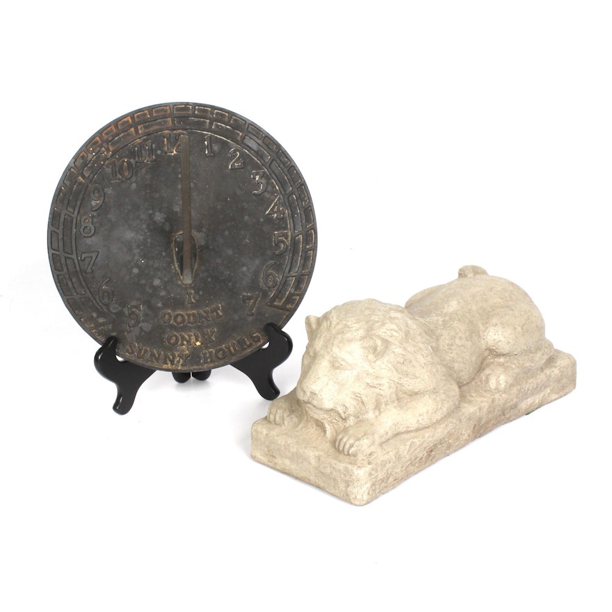 Metal Sundial and Cast Concrete Lion