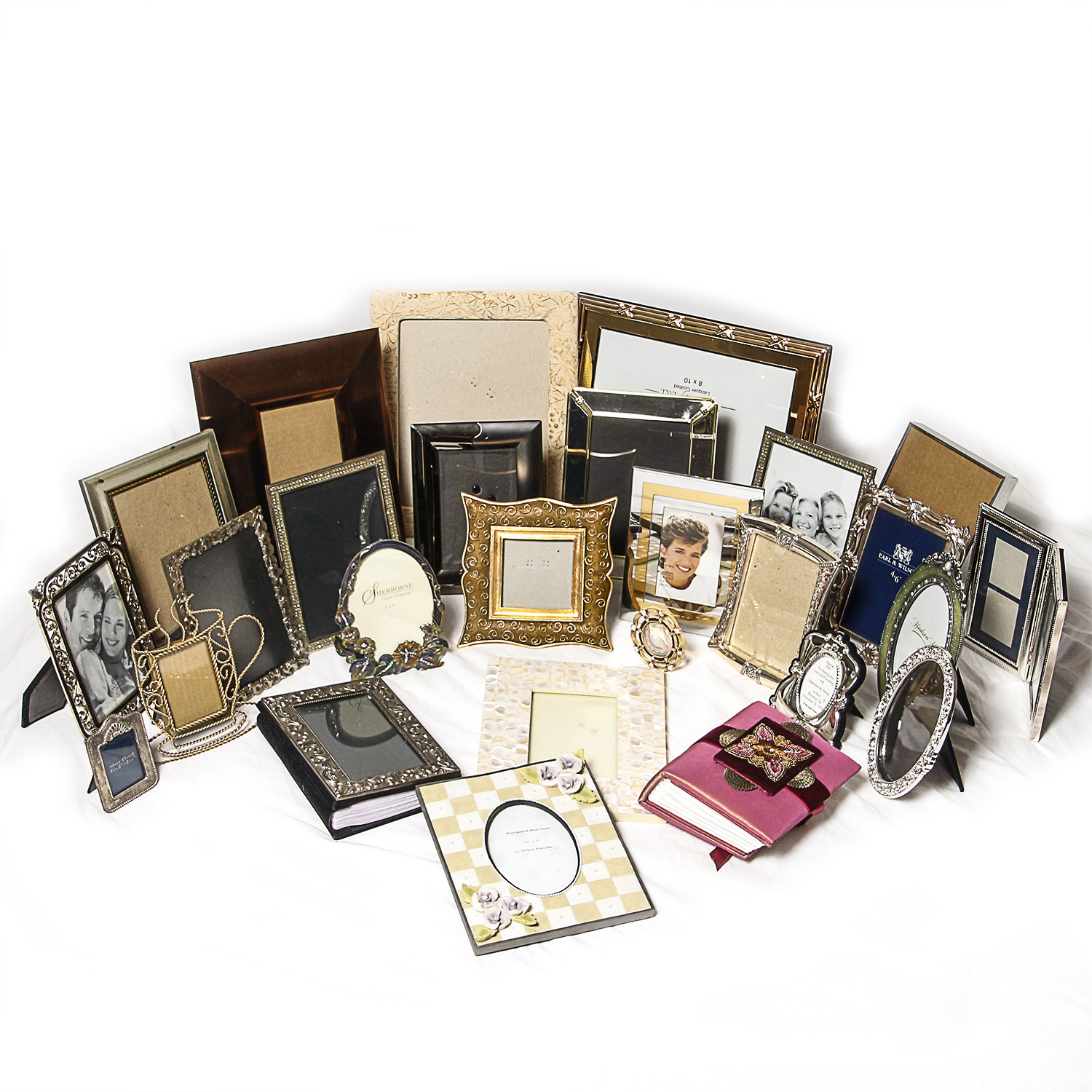 Assortment of Picture Frames and Photo Albums