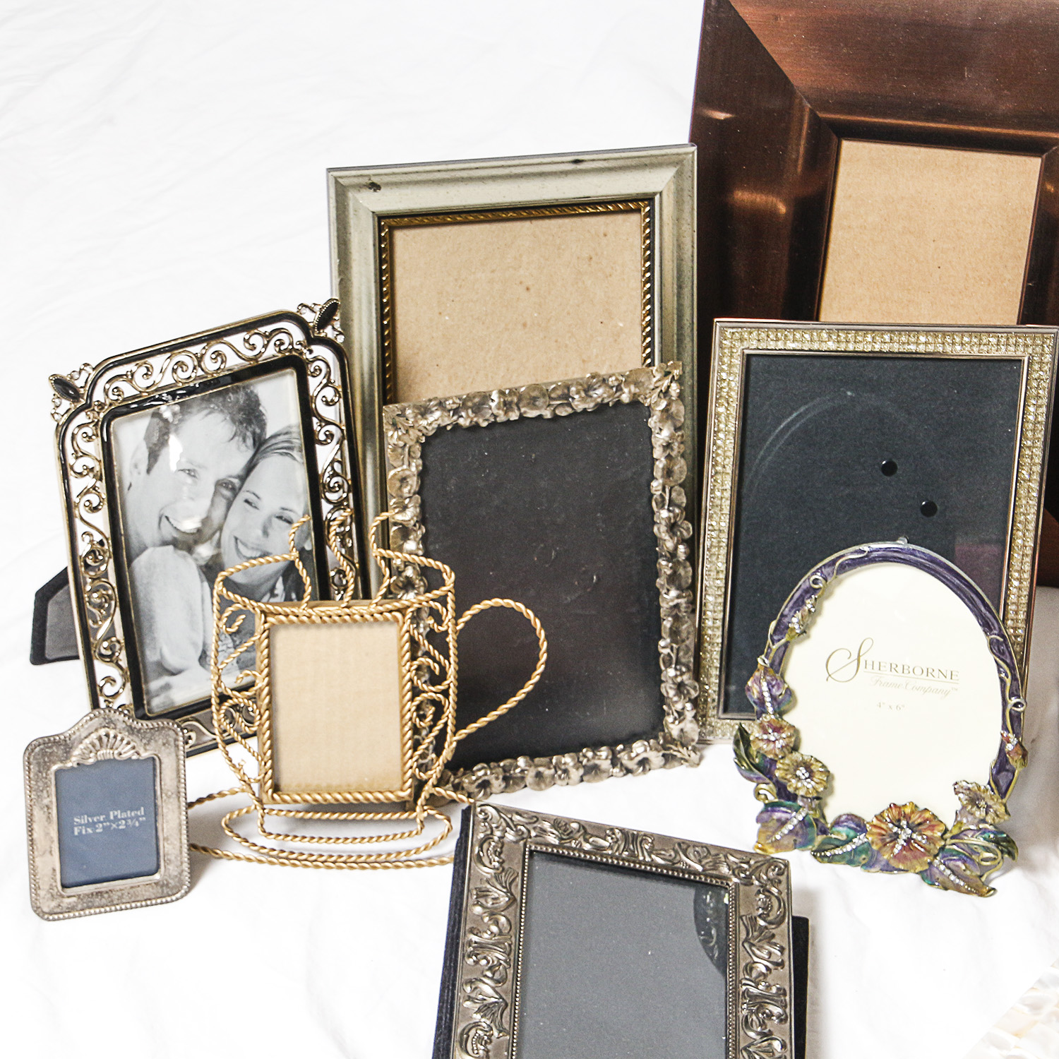 Assortment of Picture Frames and Photo Albums