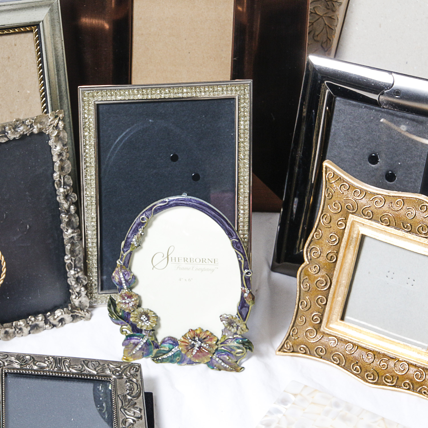 Assortment of Picture Frames and Photo Albums