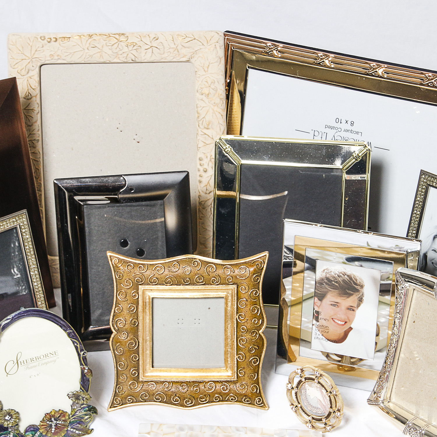 Assortment of Picture Frames and Photo Albums