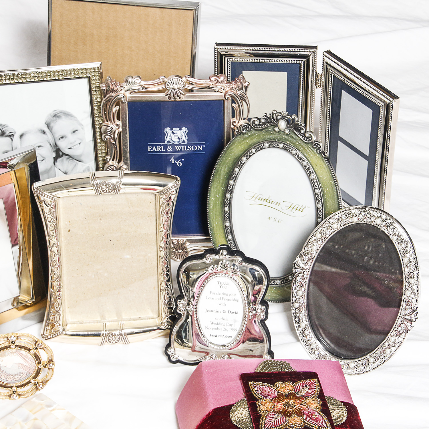 Assortment of Picture Frames and Photo Albums