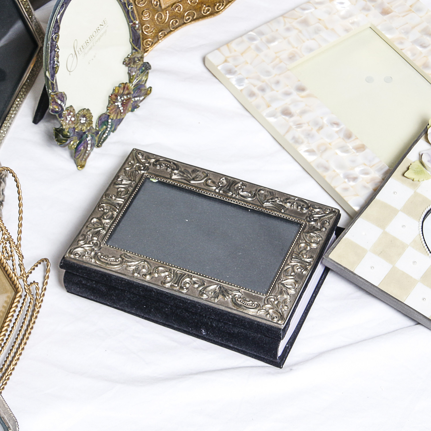 Assortment of Picture Frames and Photo Albums