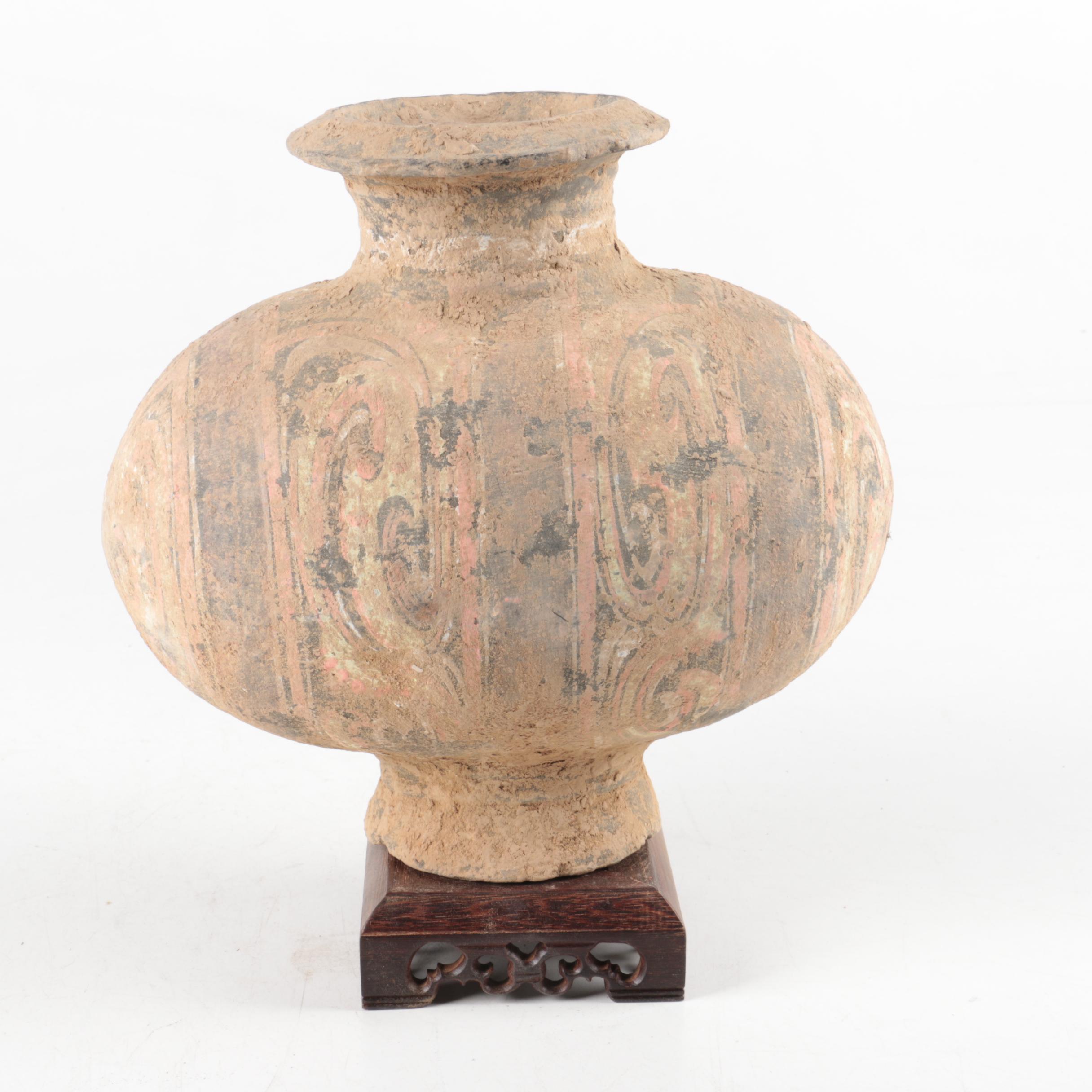 Oval Rotund Pottery Vase on Carved Wooden Stand