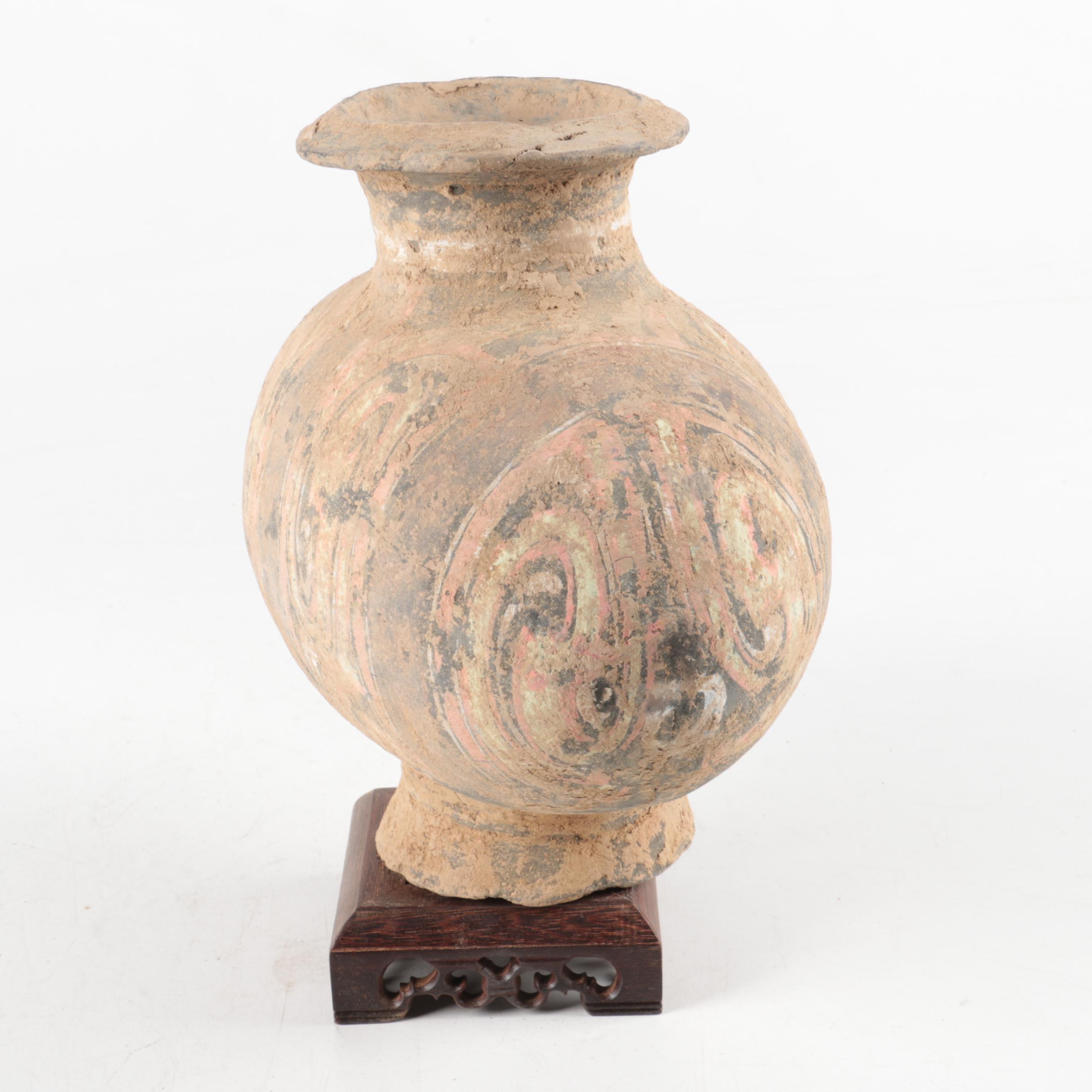 Oval Rotund Pottery Vase on Carved Wooden Stand