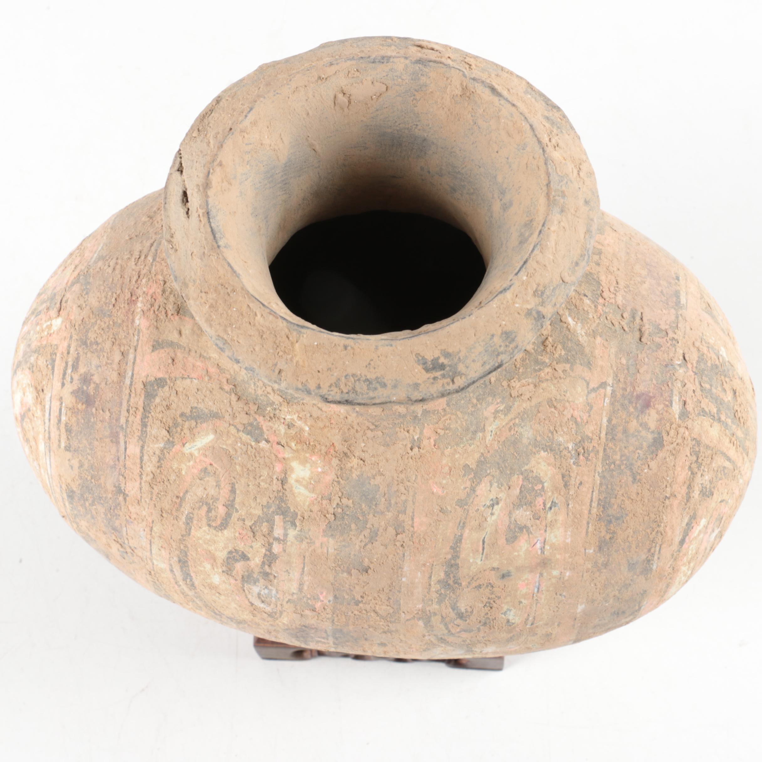 Oval Rotund Pottery Vase on Carved Wooden Stand