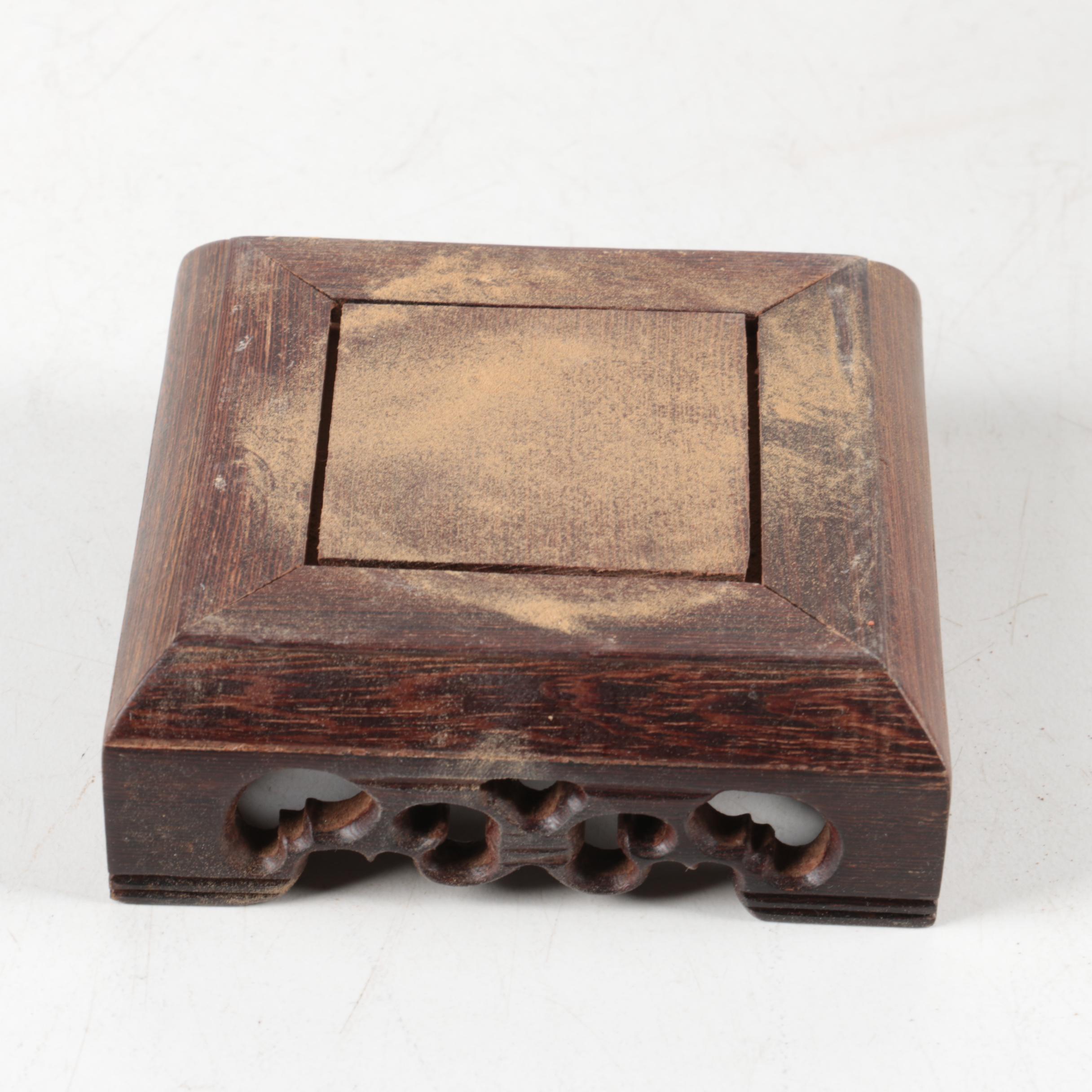 Oval Rotund Pottery Vase on Carved Wooden Stand