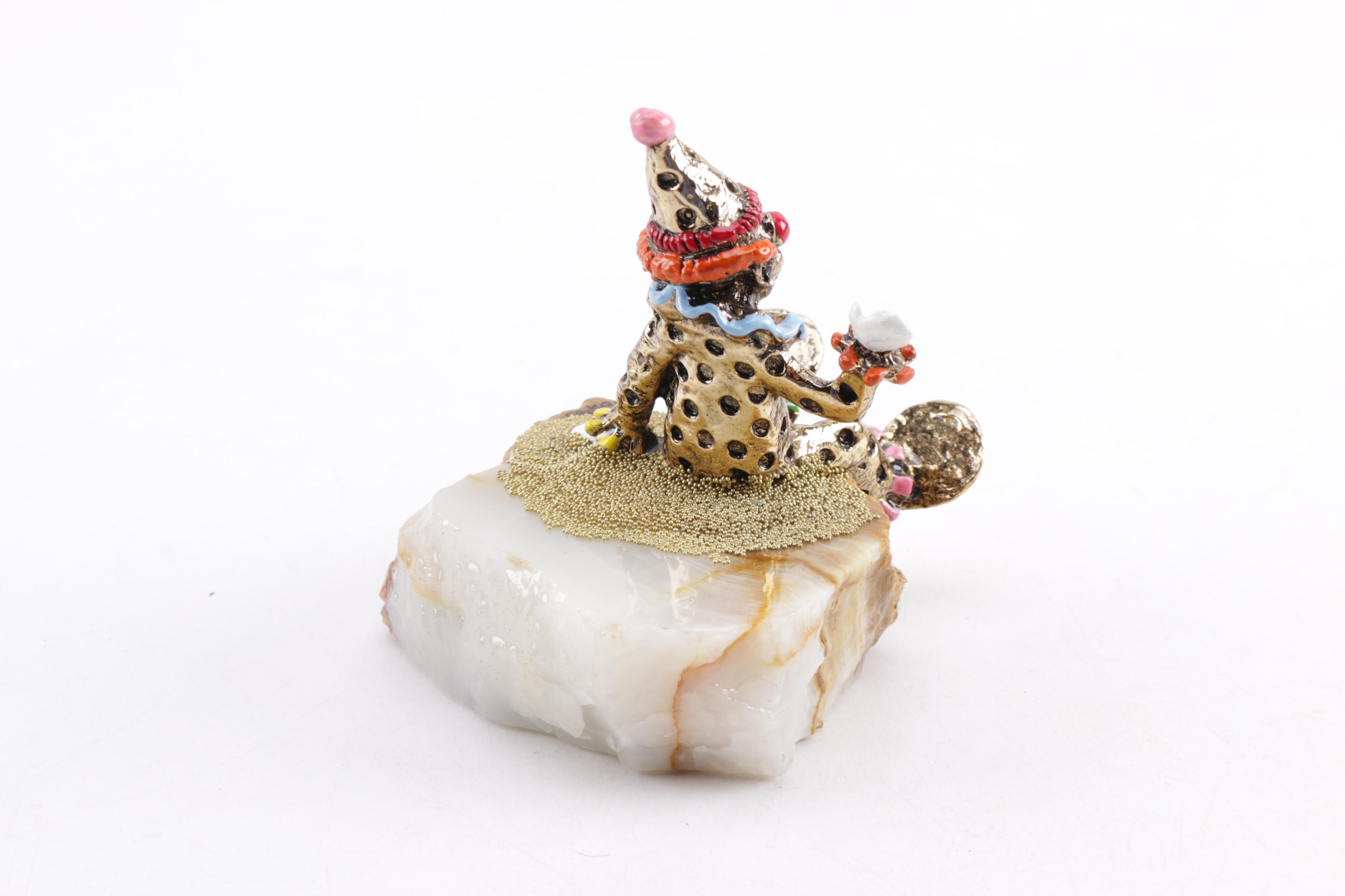 Pair of Seated Clown Figurines on Stone Bases