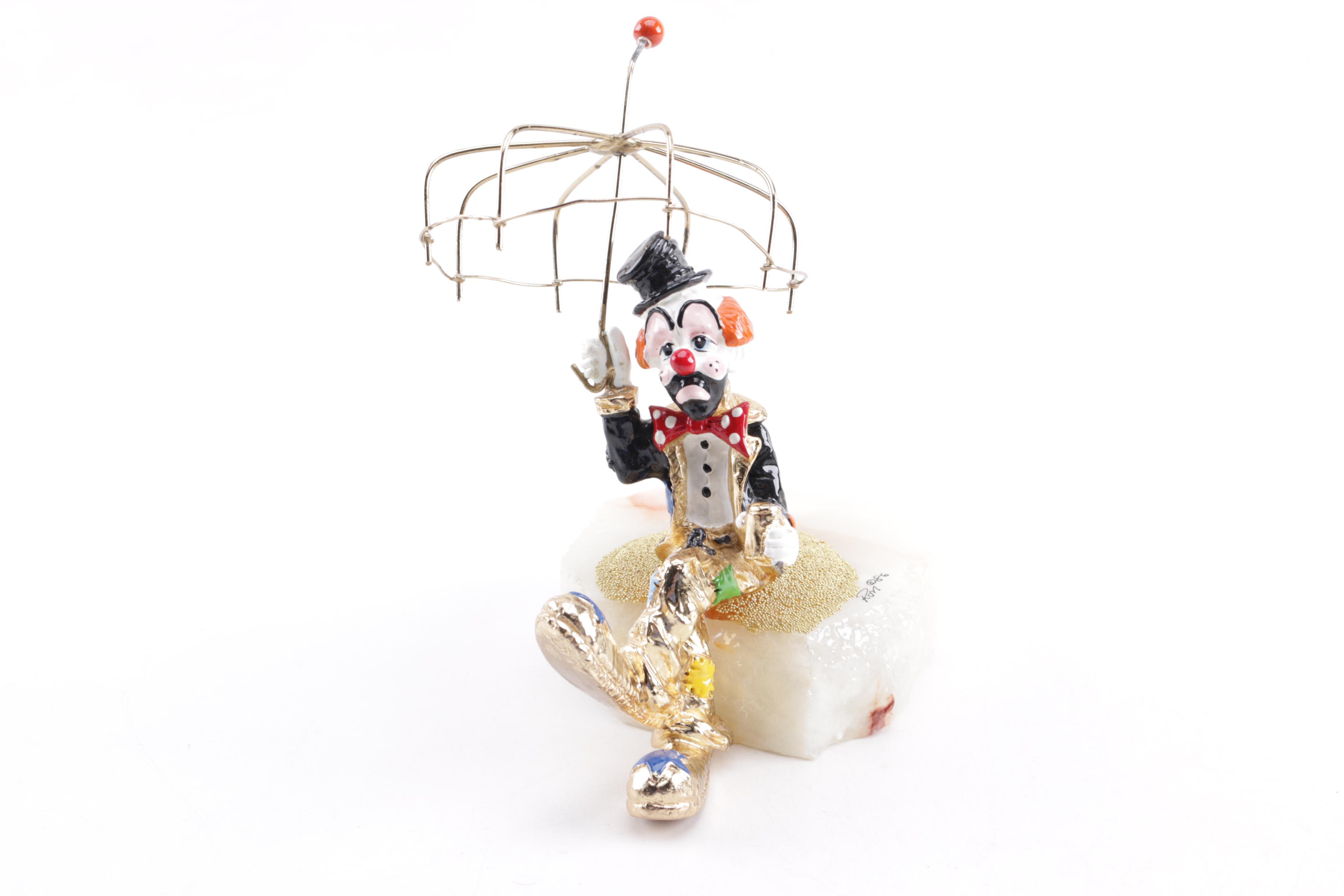 Pair of Seated Clown Figurines on Stone Bases