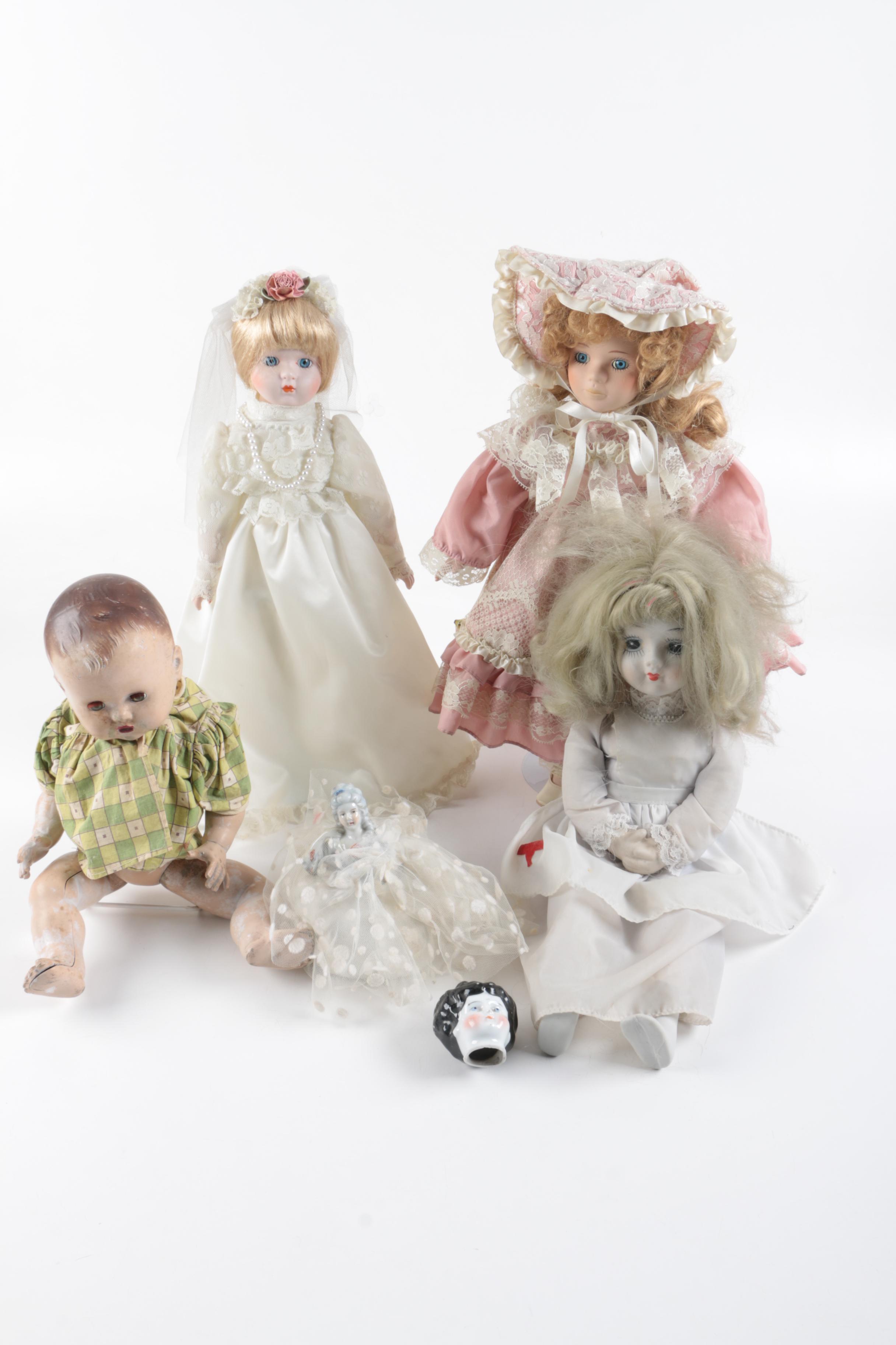 C. 1940s Imperial Composition Baby Doll with Vintage Porcelain Dolls