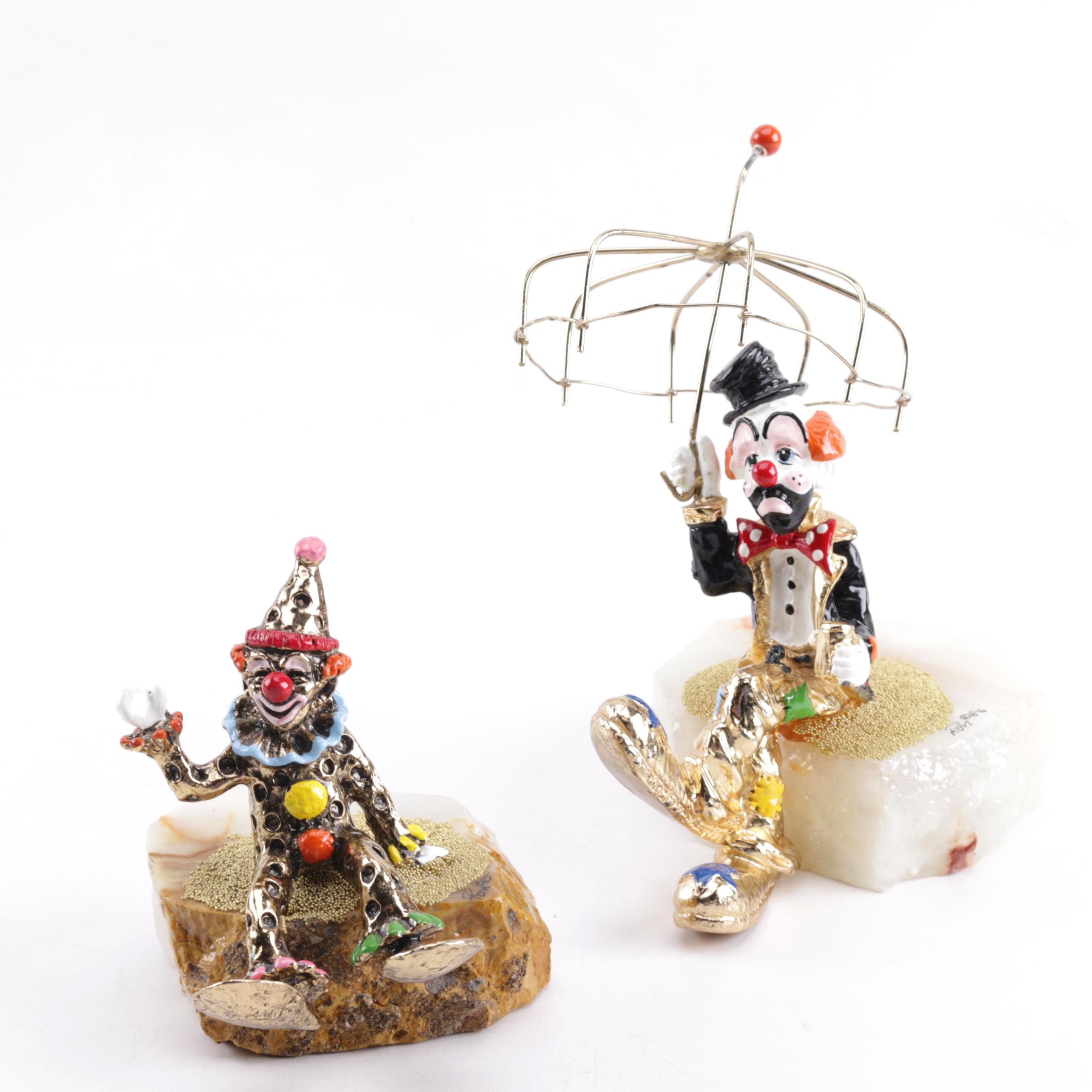 Pair of Seated Clown Figurines on Stone Bases