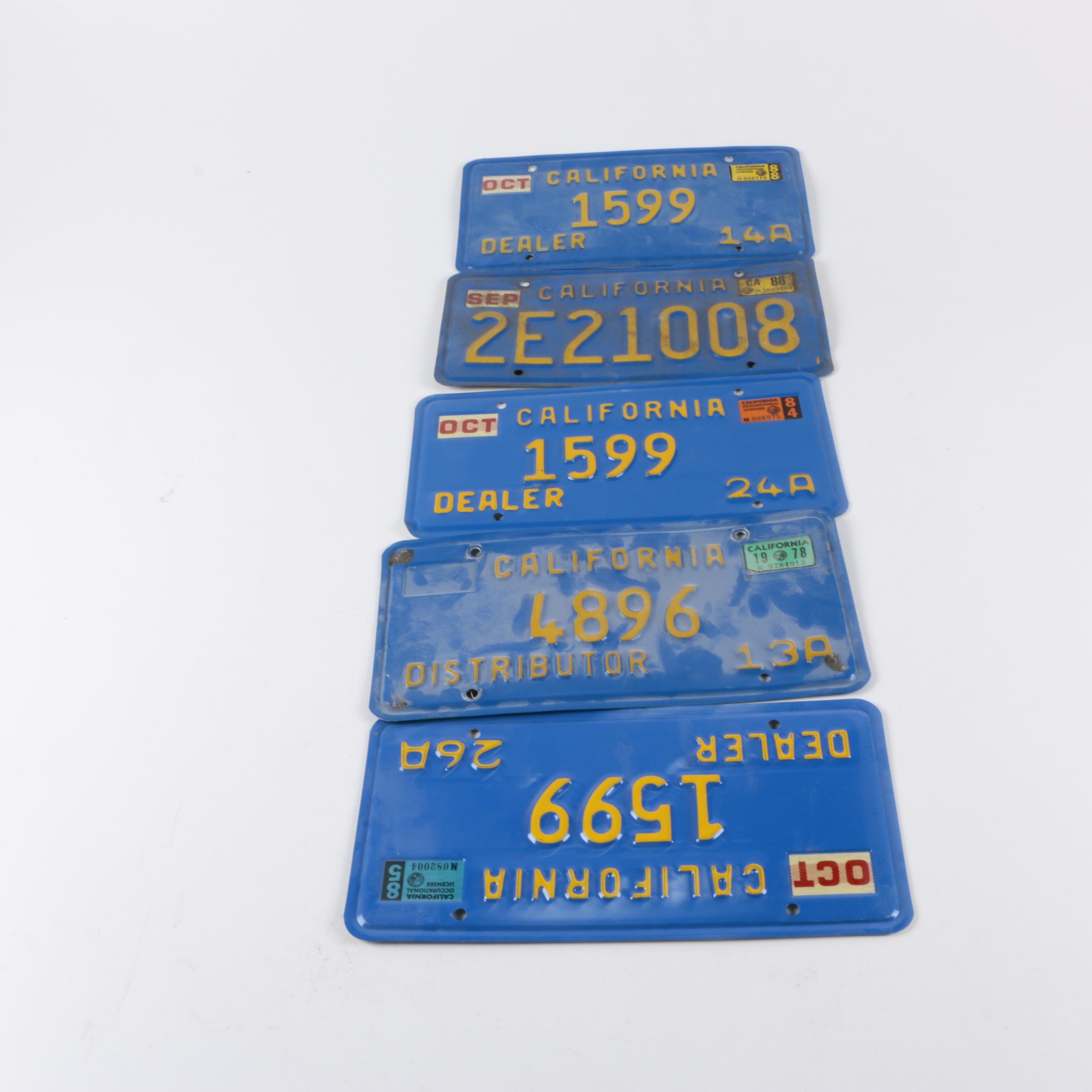 Vintage California License Plates Including Blue/Yellow And Sun Graphic