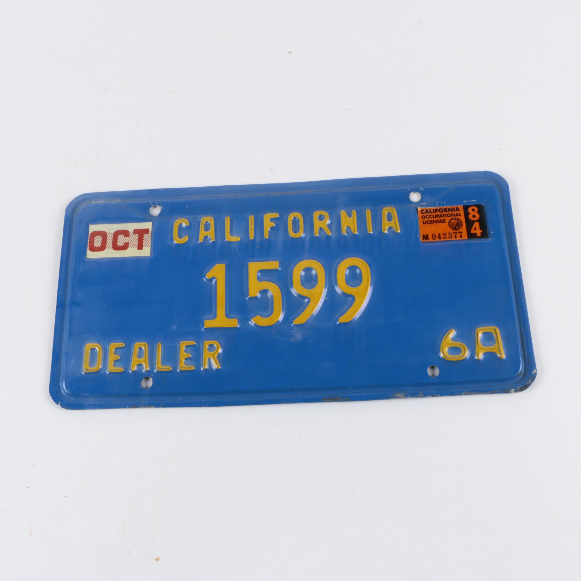 Vintage California License Plates Including Blue/Yellow And Sun Graphic