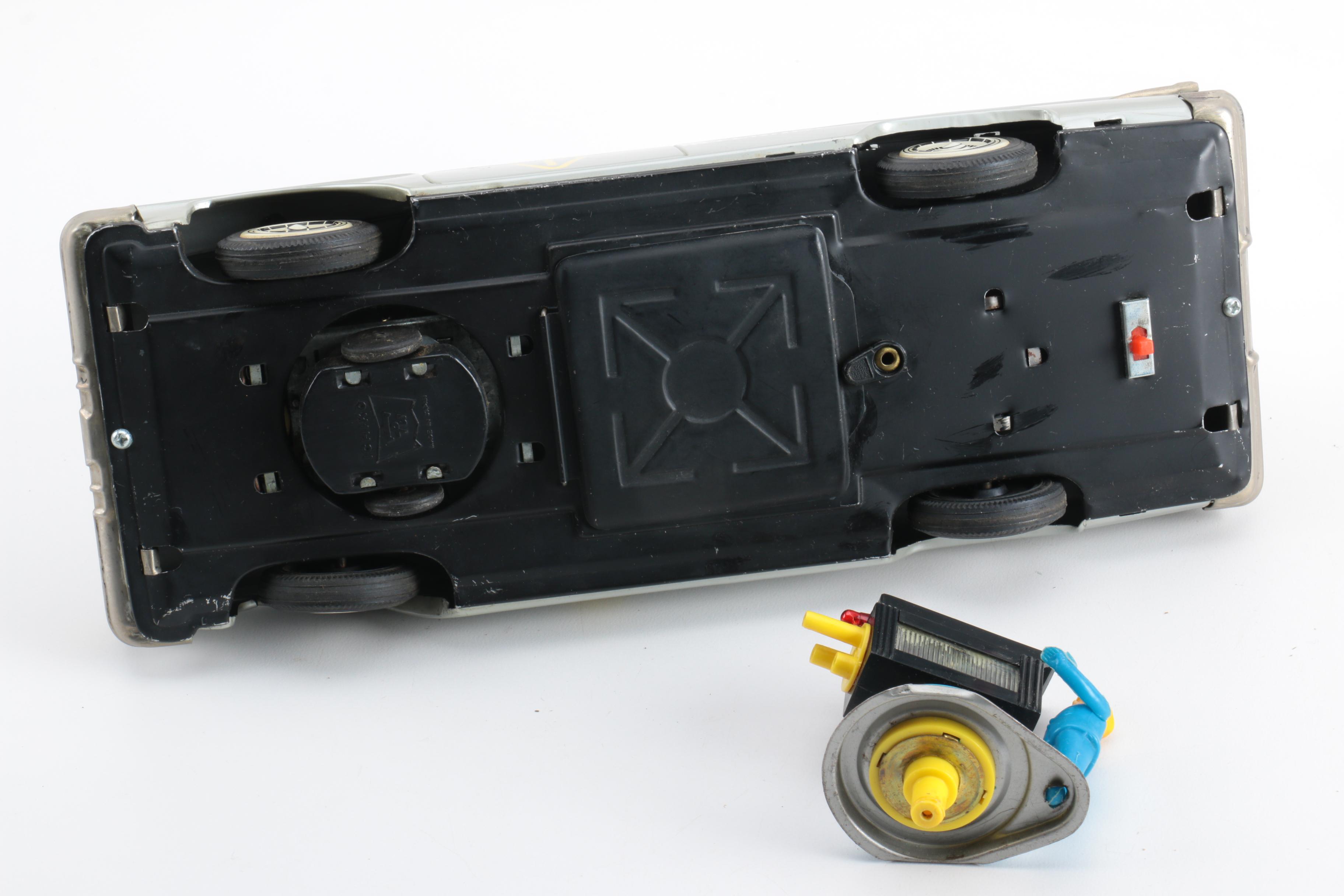 Four Vintage Japanese Metal Battery Operated Toys