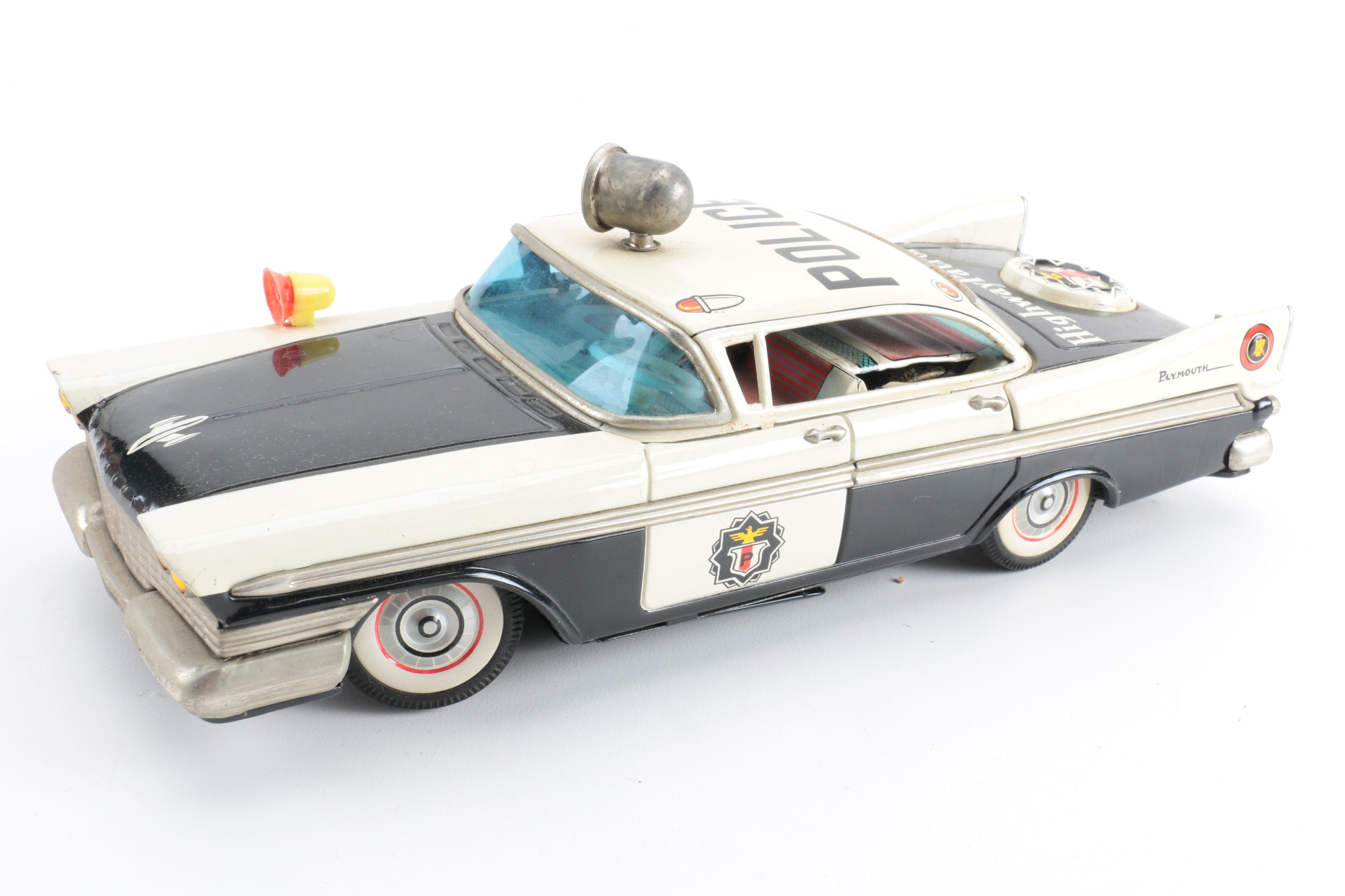 Four Vintage Japanese Metal Battery Operated Toys