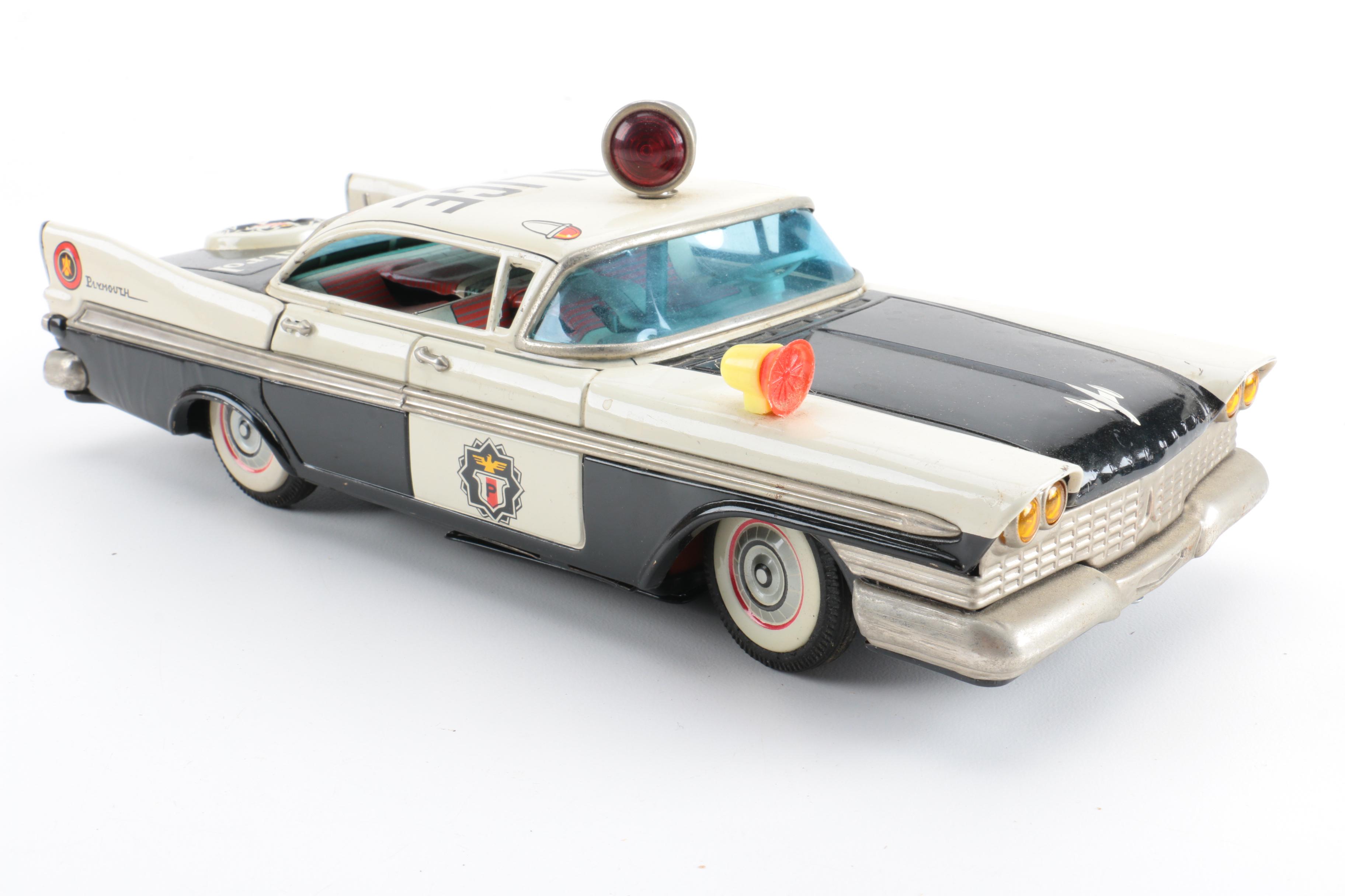 Four Vintage Japanese Metal Battery Operated Toys