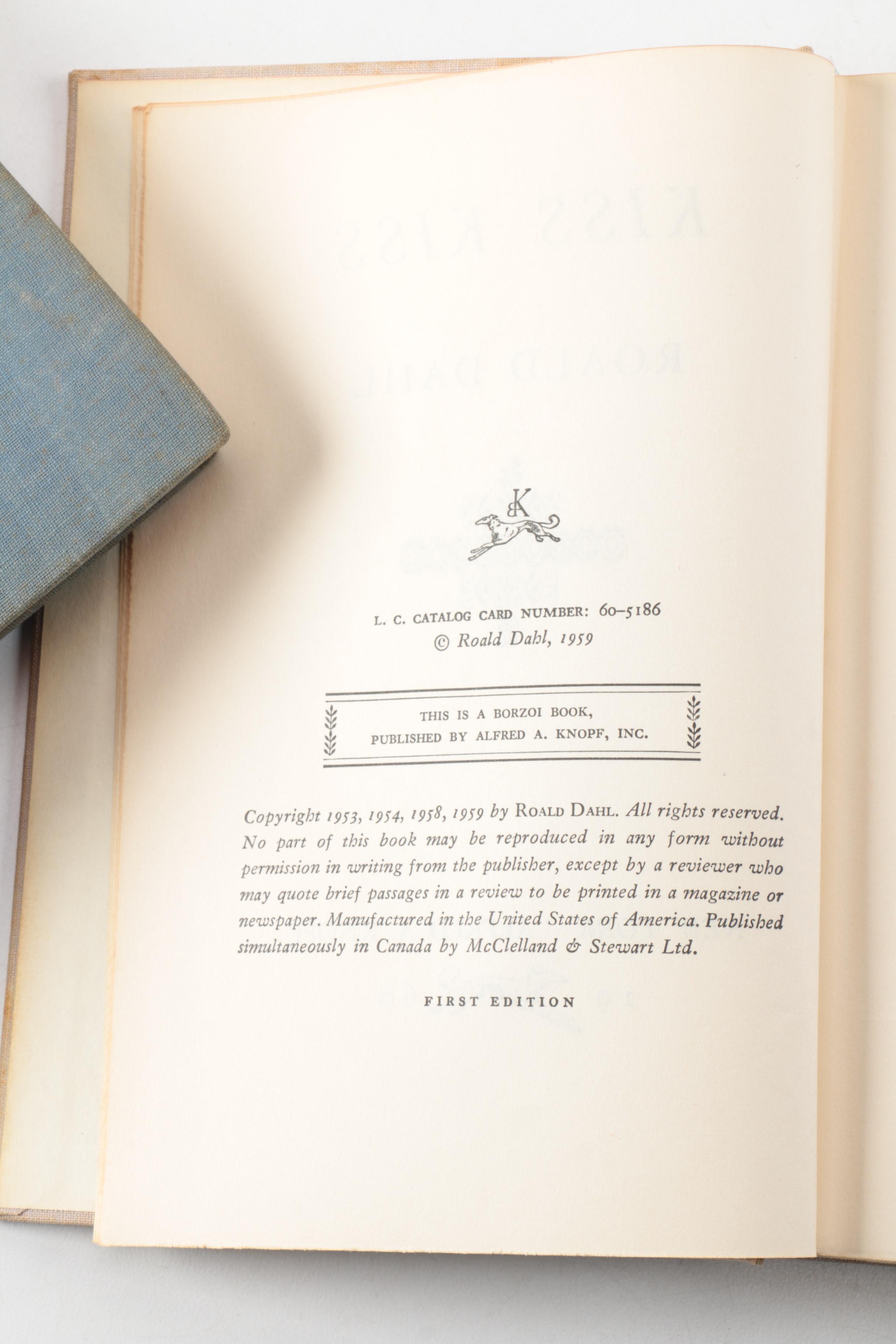 Nine Vintage Hardcover Books Featuring Roald Dahl and Ernest Hemingway