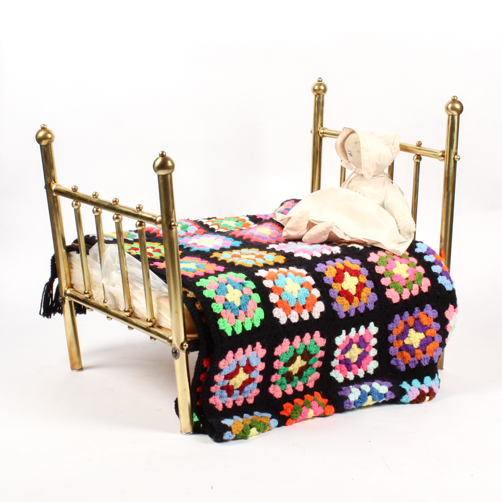 Brass Doll's Bed with Doll and Crochet Throw
