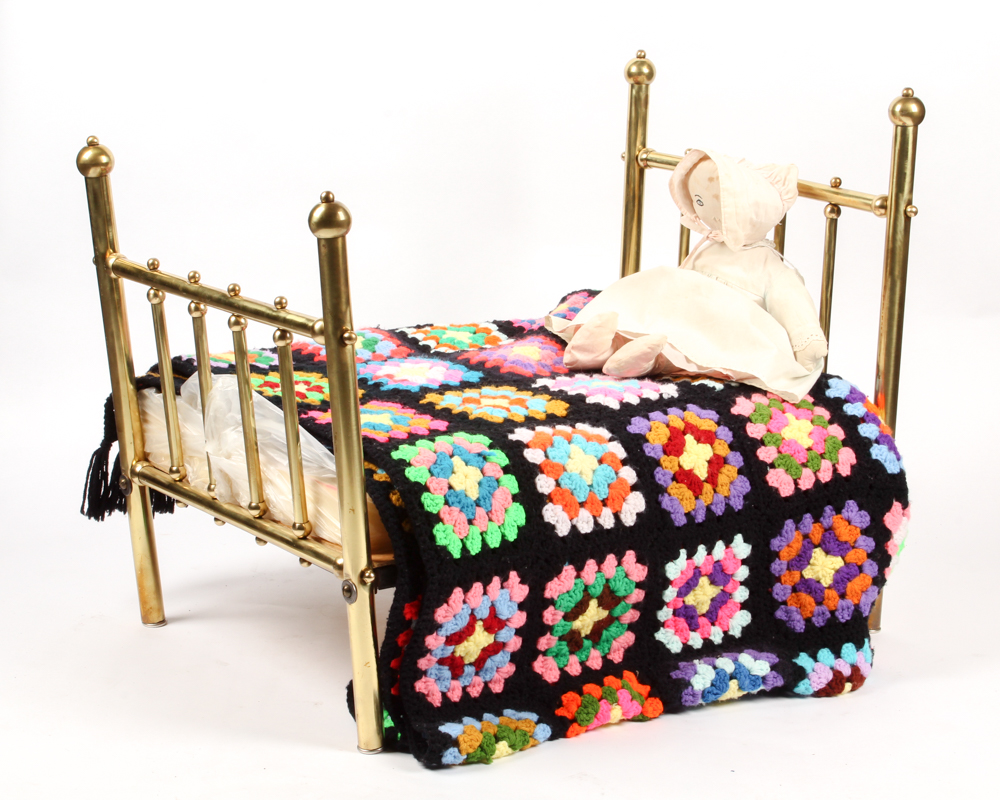 Brass Doll's Bed with Doll and Crochet Throw