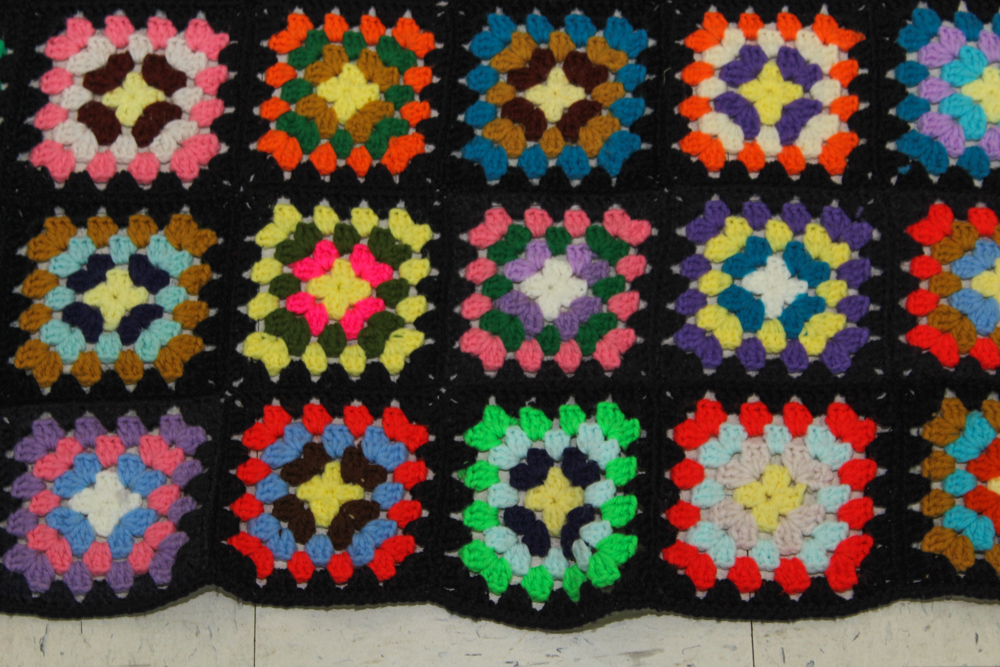 Brass Doll's Bed with Doll and Crochet Throw