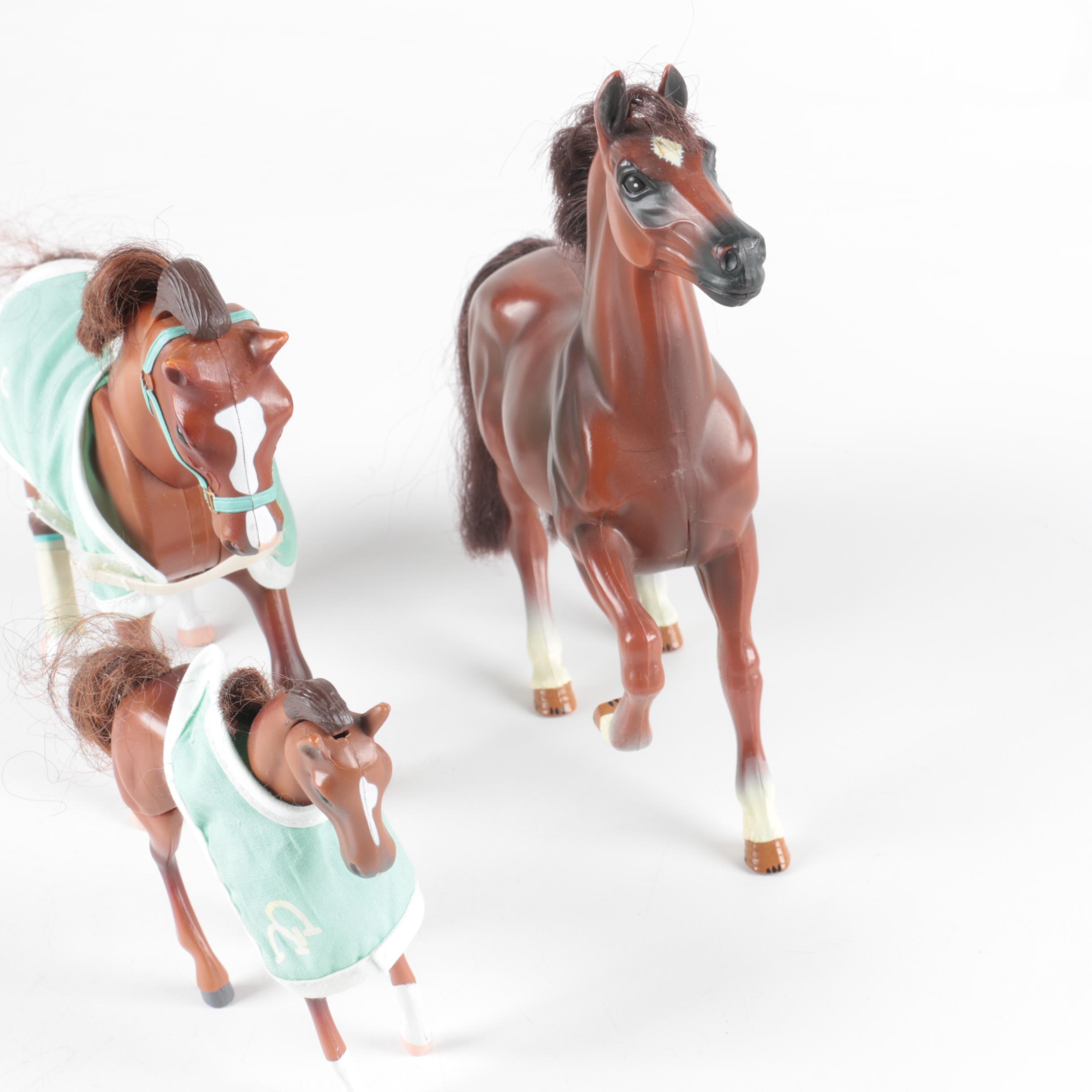 Nine Plastic Toy Horse Figures