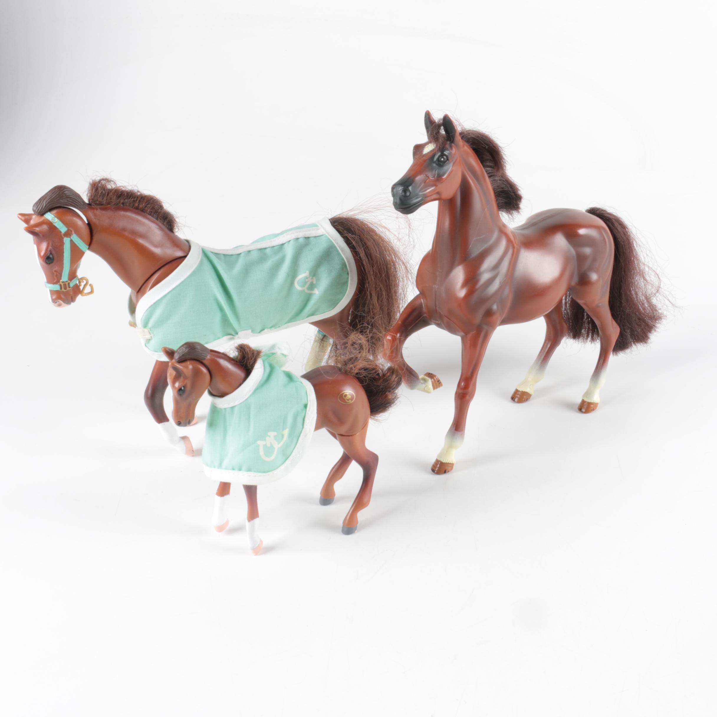 Nine Plastic Toy Horse Figures